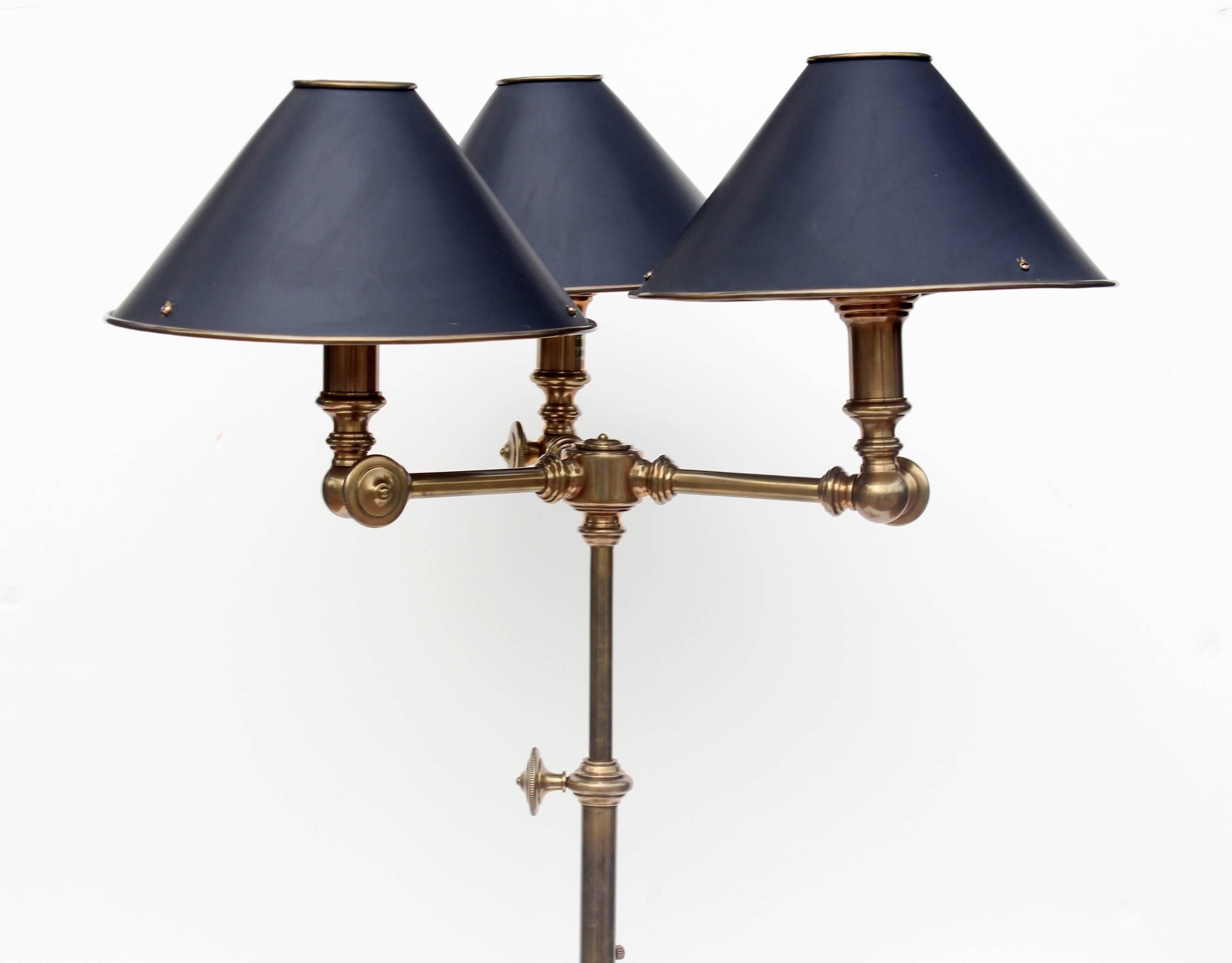 Pair of Chapman manufacturer adjustable brass lamps. In the style of the old gaslight fixtures. Shades are adjustable and also made of brass.