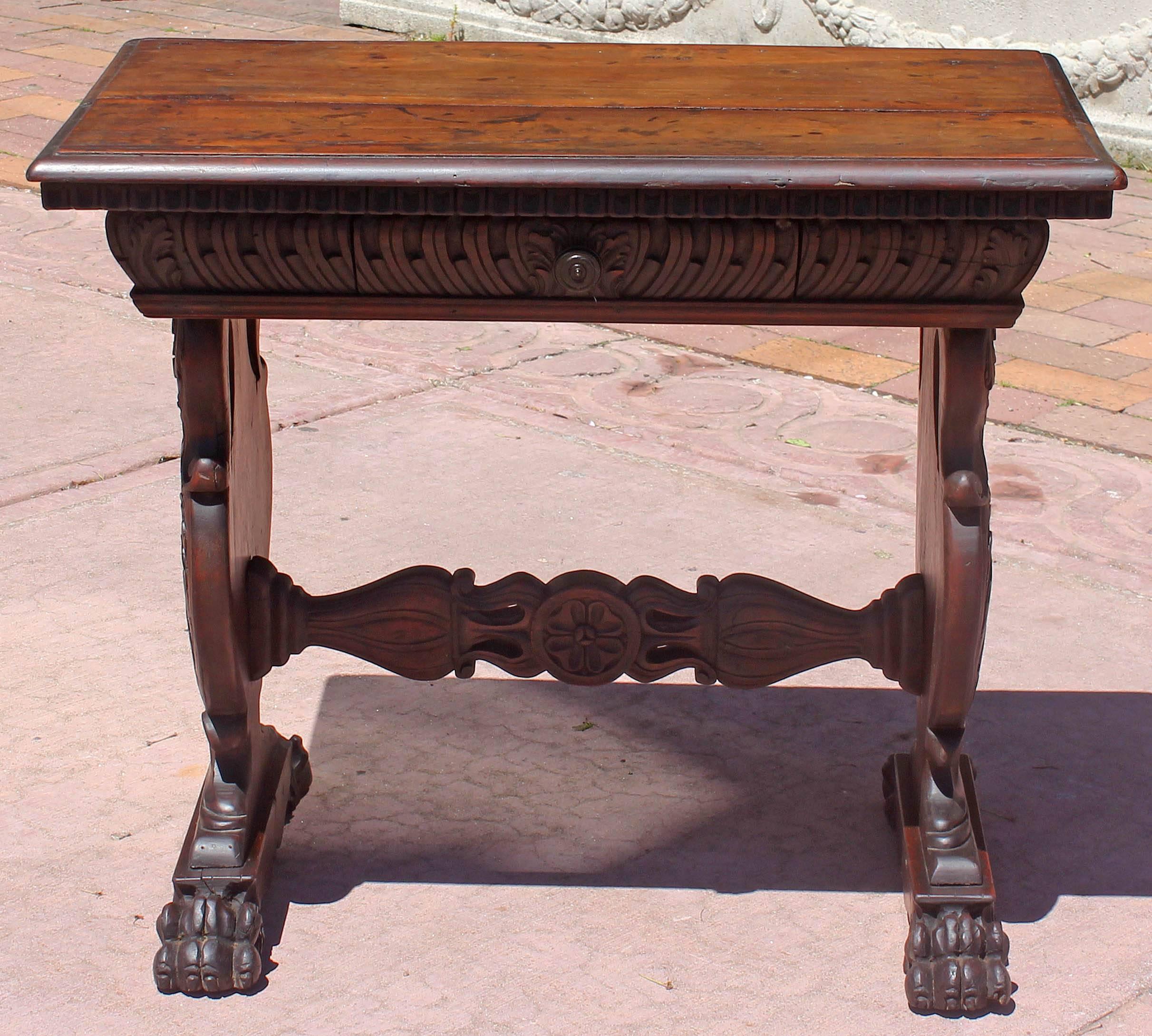 Antique Baroque walnut side table. Well carved with rich patina. Made of 18th and 19th century elements. Single drawer.