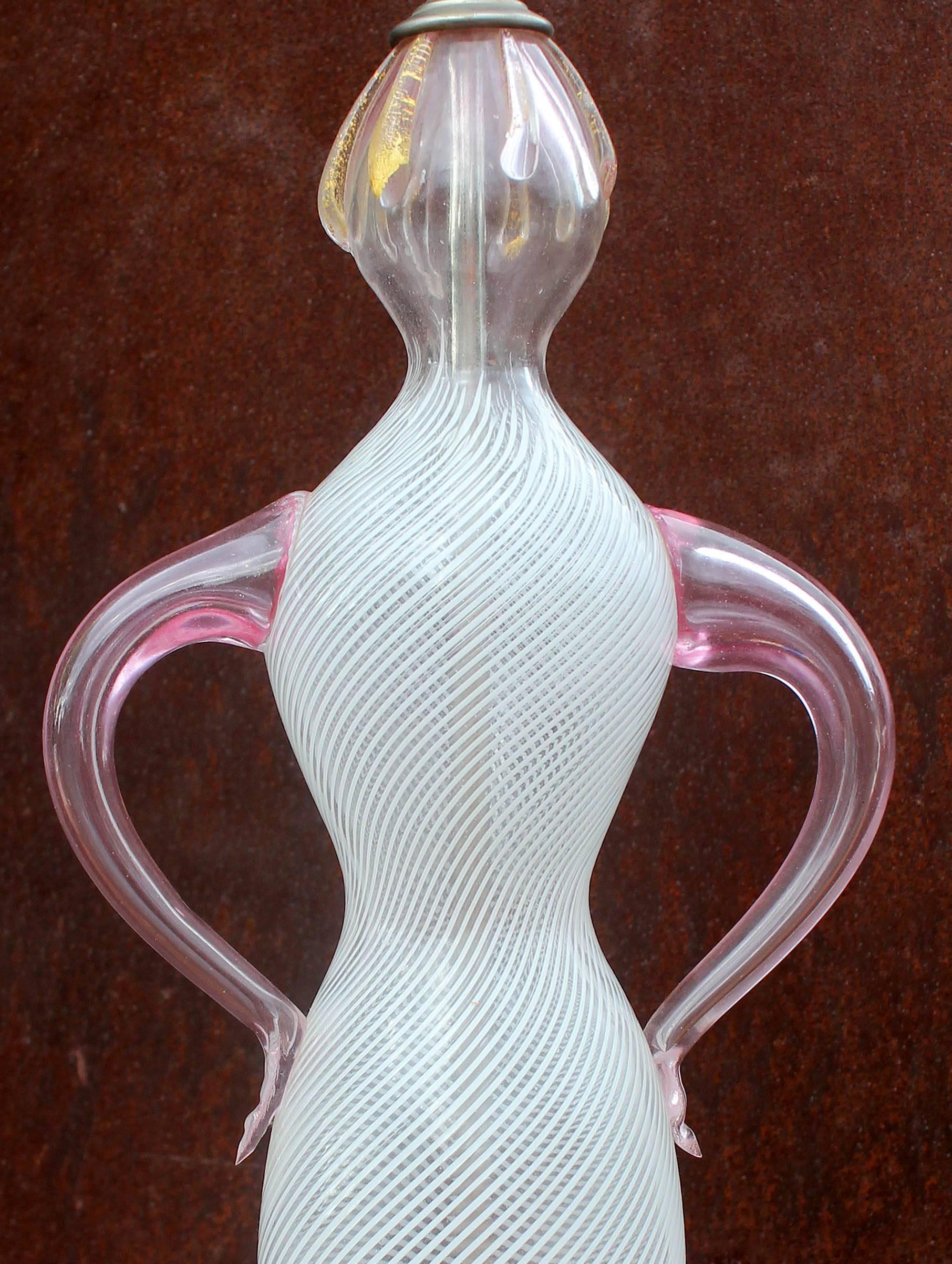 An unusual and possibly unique Murano lamp. A delicate abstract sculpture of a female figure. Purchased by the original owner in 1954. Figure measures 15 1/2