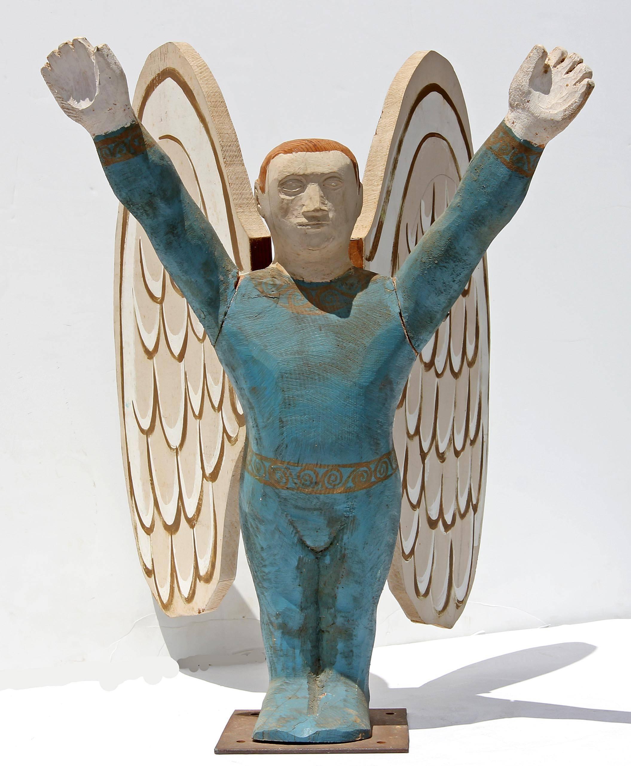 Group carved and painted American Folk Art angels in acrobat outfits. Carved pine, circa 1950s-1960s.
