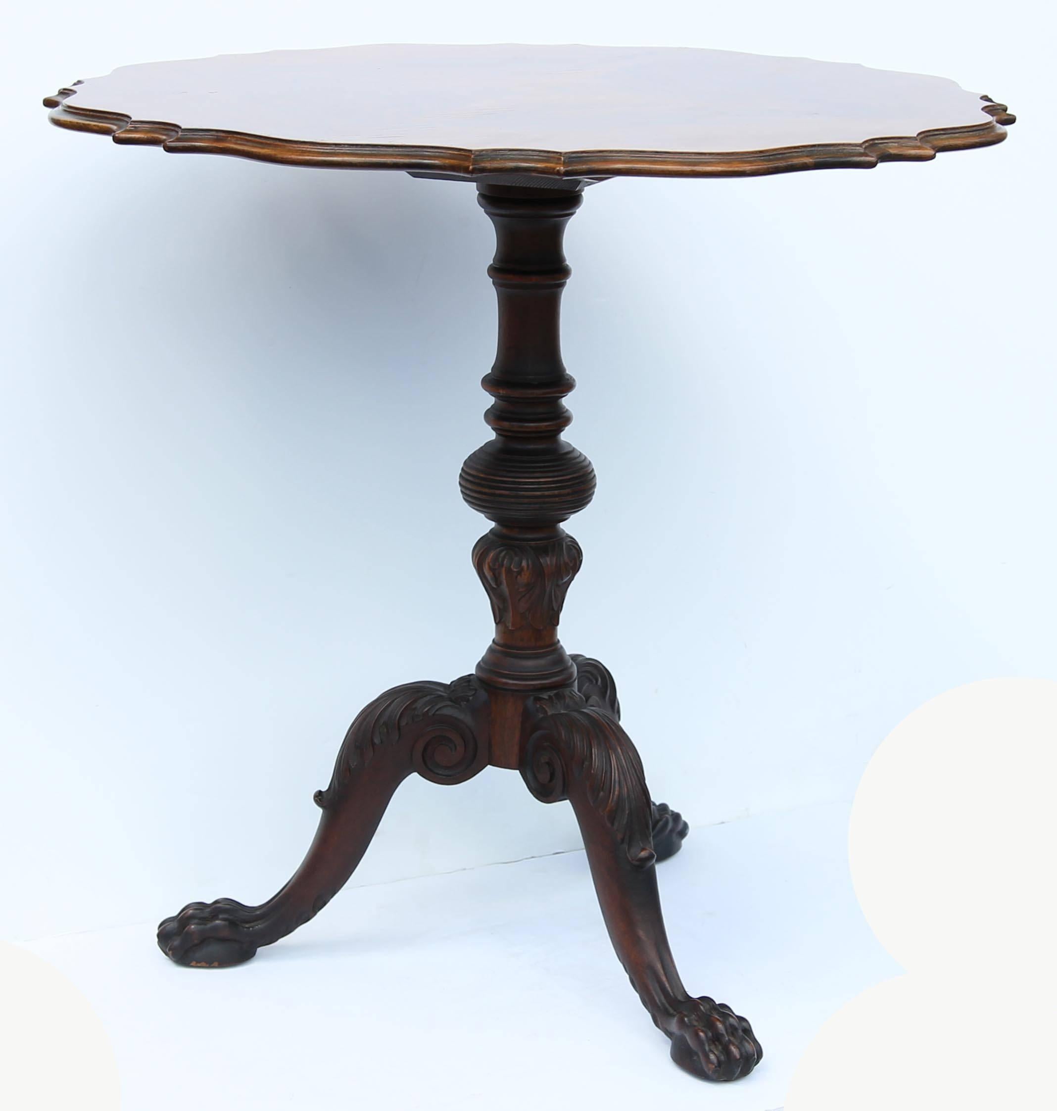 Chippendale centennial pie crust tilt top tea table. Carved mahogany base with figured rosewood top, circa 1920. Exceptional quality carving.