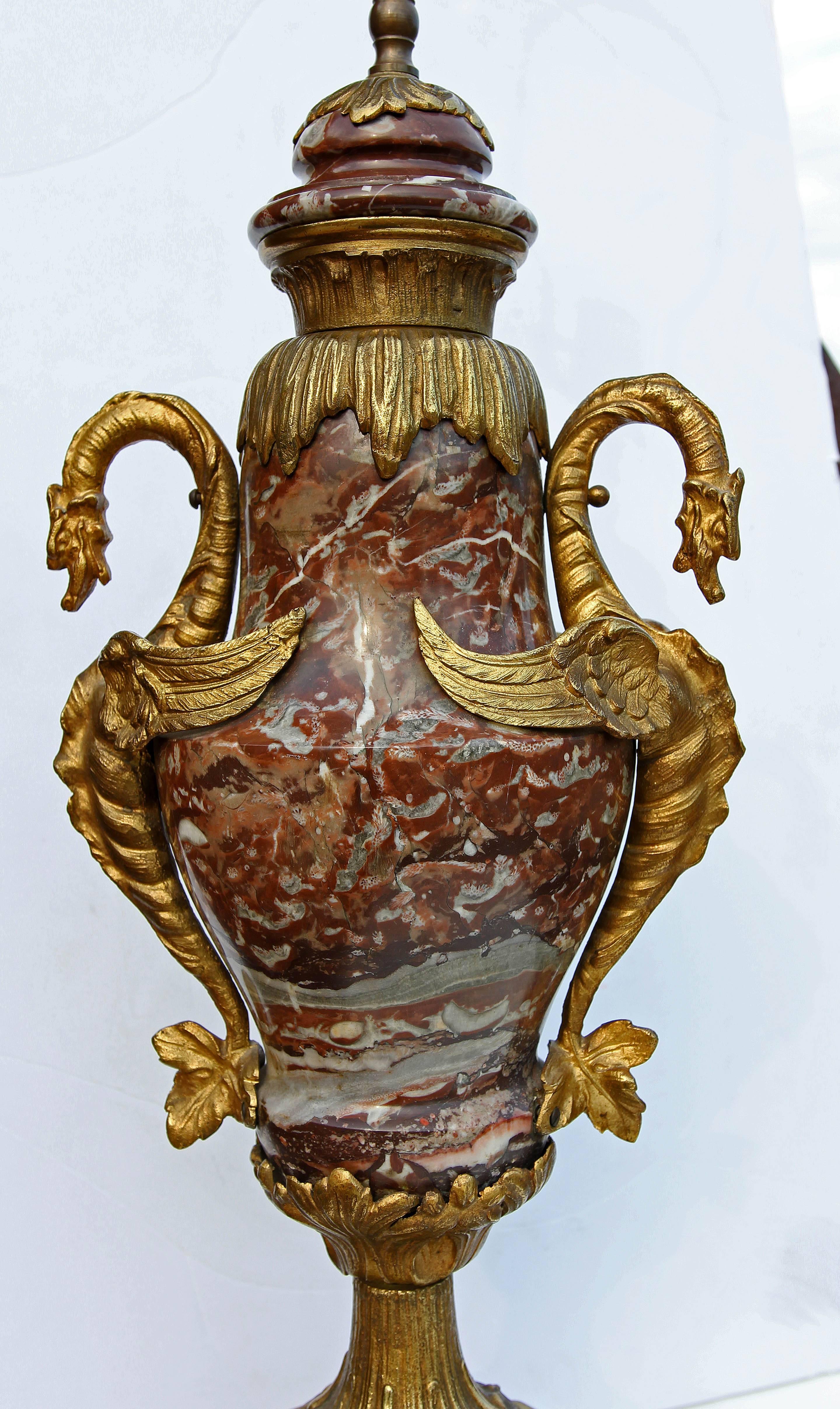 Pair of 19th century style variegated marble lamps with brass mounts. Good quality castings. Includes good sized finials. Over all height with harp and finial is 40
