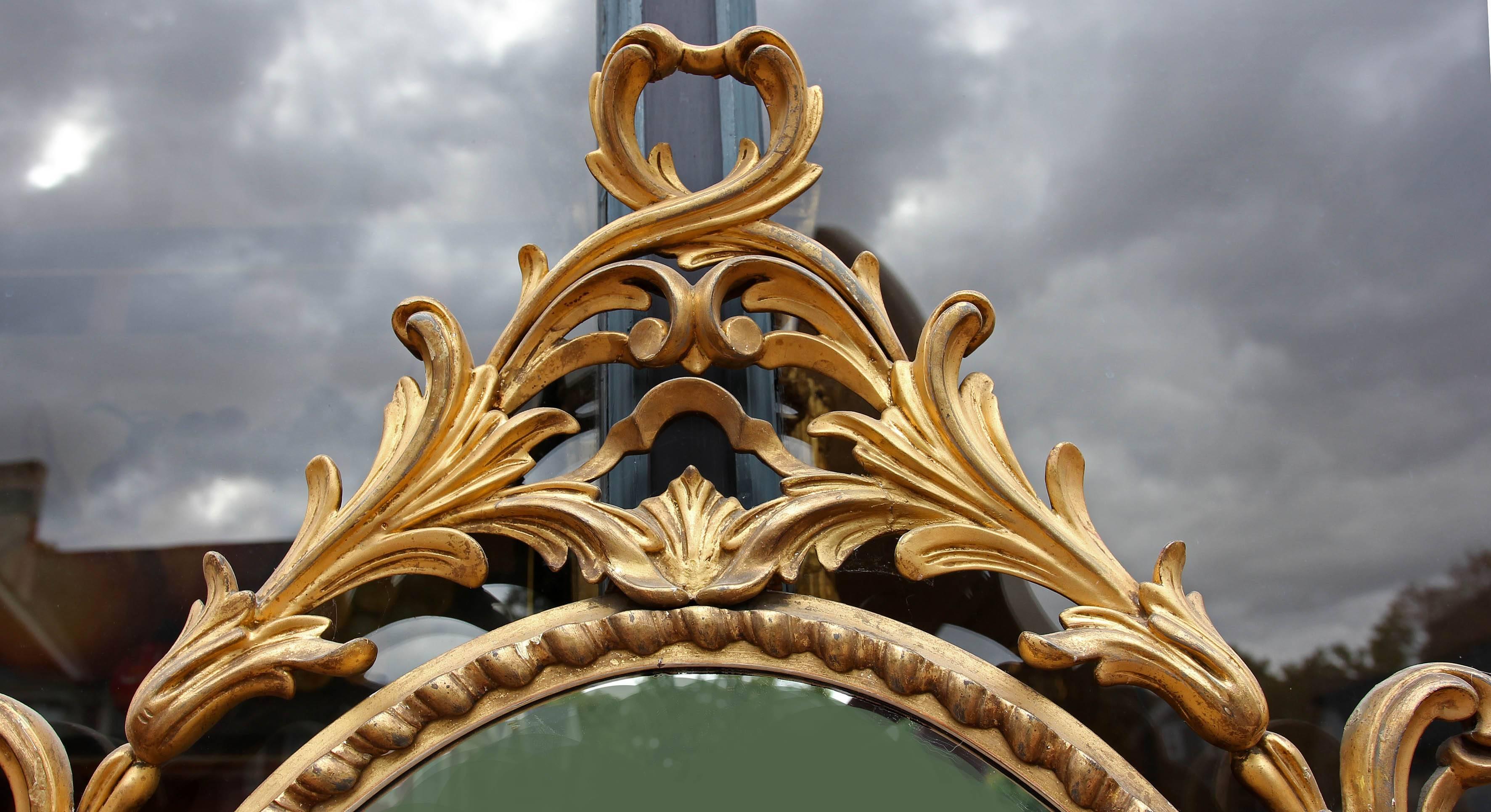 French 19th century gilt and carved wood mirror. Excellent quality. A beautiful and fluid design.
