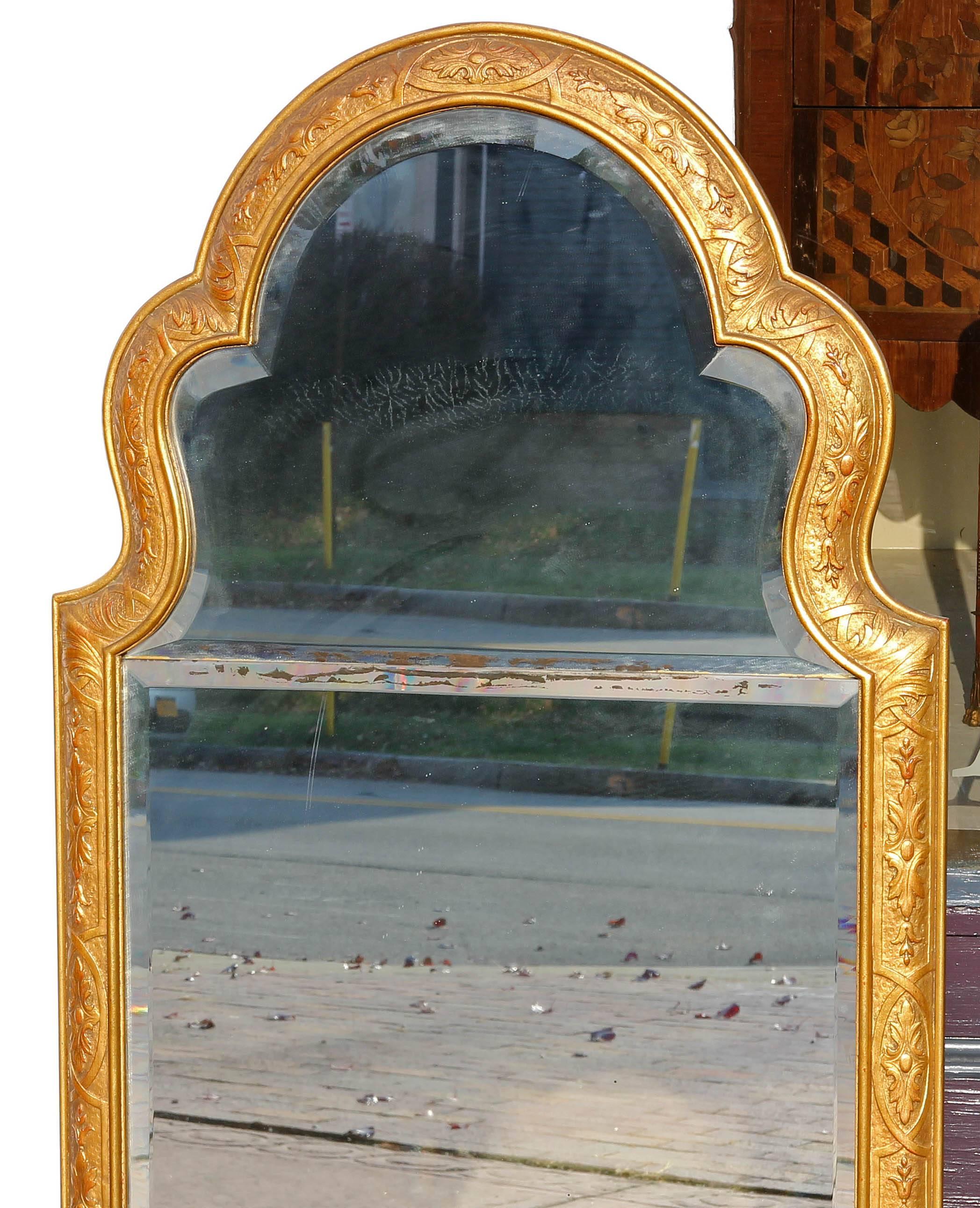 Finely carved gilt wood mirror. Beveled glass mirror, early 20th century.