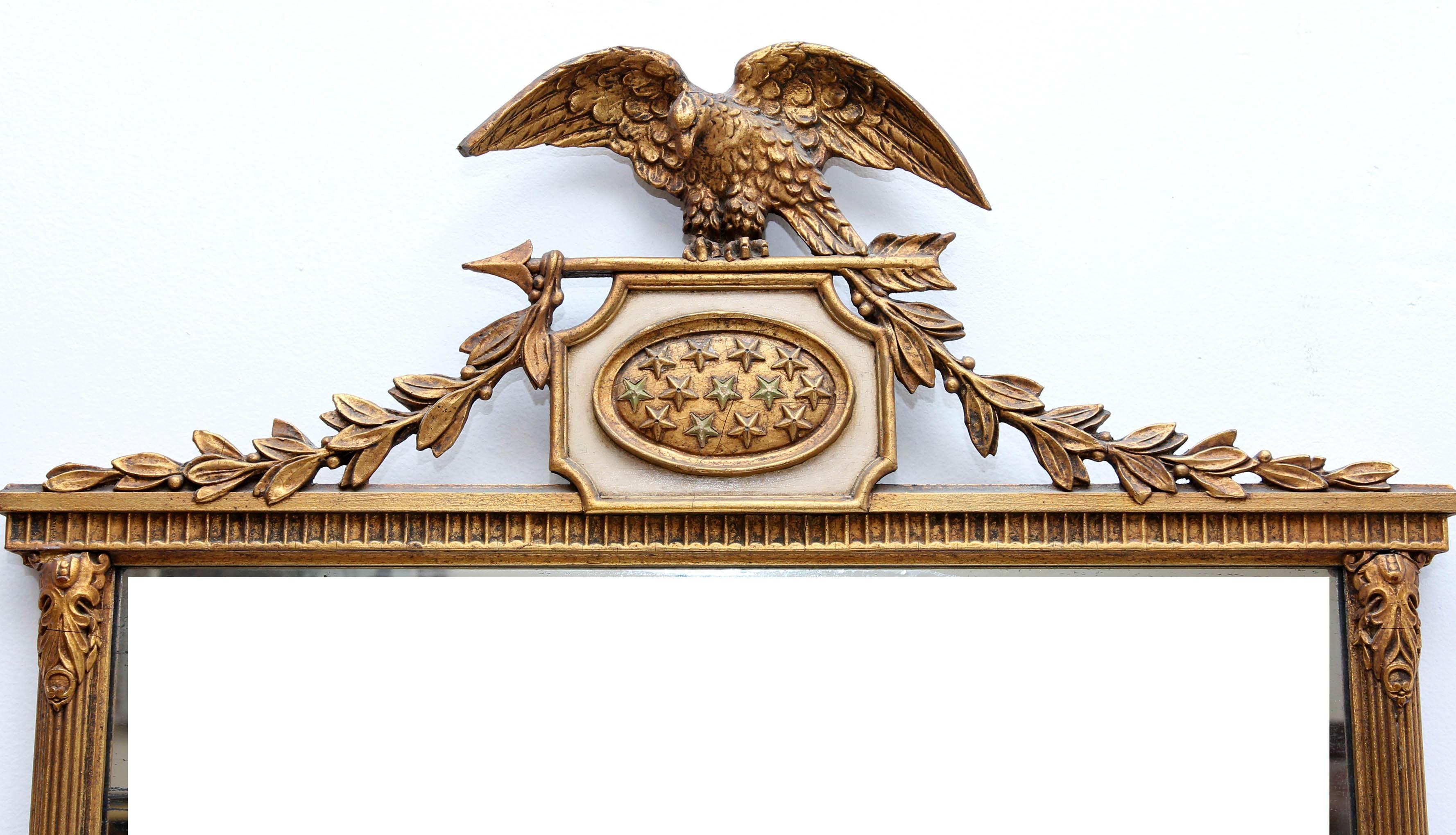 Antique American Chippendale  style gilt mirror with eagle crest and cartouche with stars. Giltwood and composition. Circa 1920's.