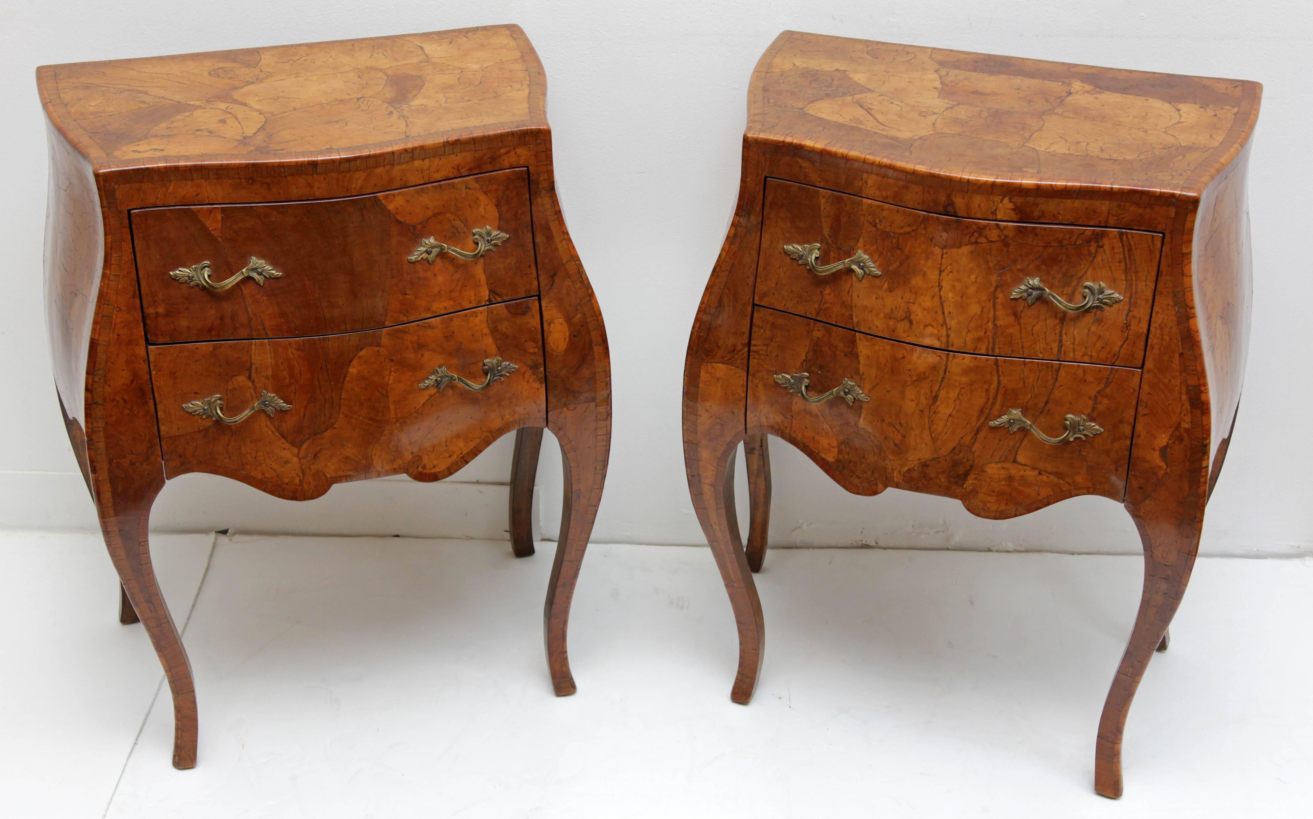 Pair of Provencal Italian bombe side or end tables. Richly veneered in in figured walnut, circa 1940s.