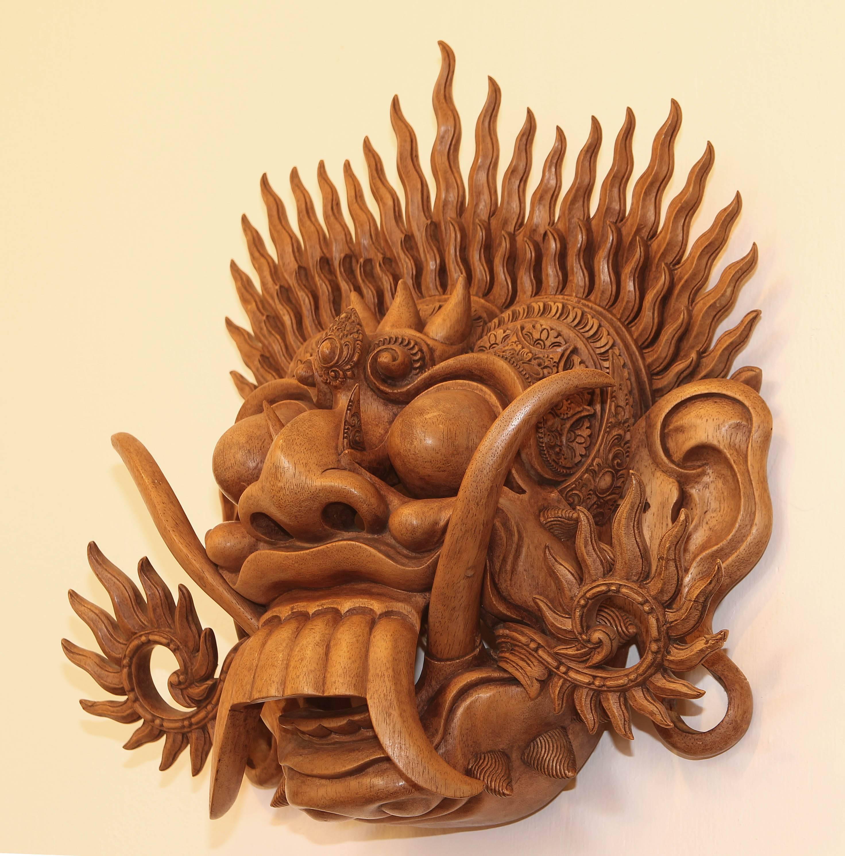Finely carved mahogany Balinese mask. Barong is a lion like creature and character in the mythology of Bali, Indonesia. He is the king of the spirits, leader of the hosts of good.