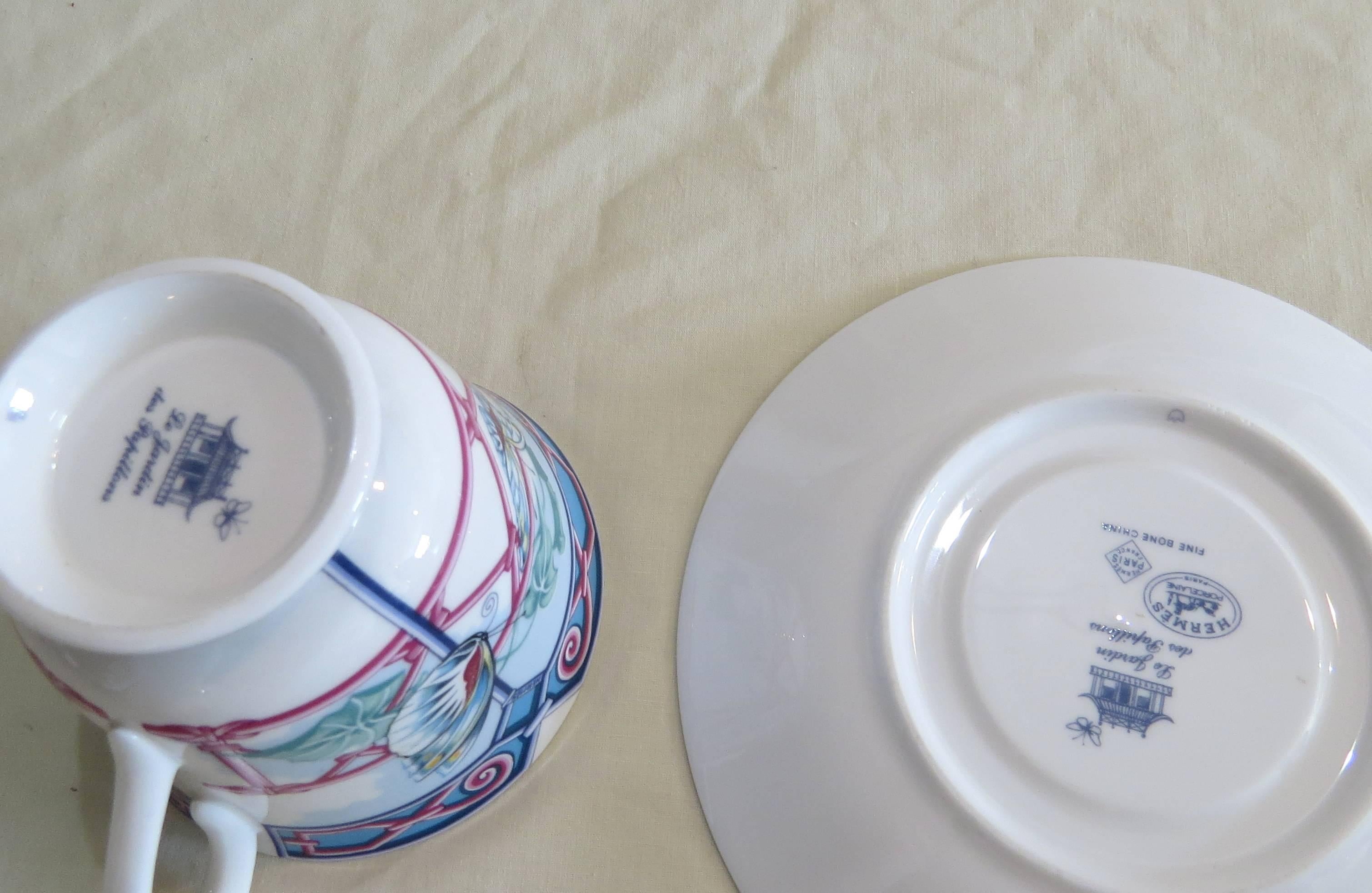 16-piece Hermes porcelain tea cup and dish set for eight, designed for Papillons collection. Plate is 5 7/8