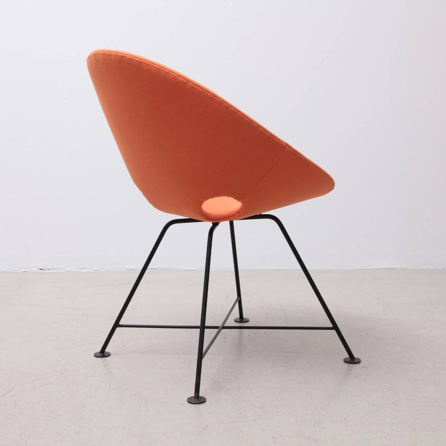 Rare Eddie Harlis chair upholstered in orange fabric for Thonet.

