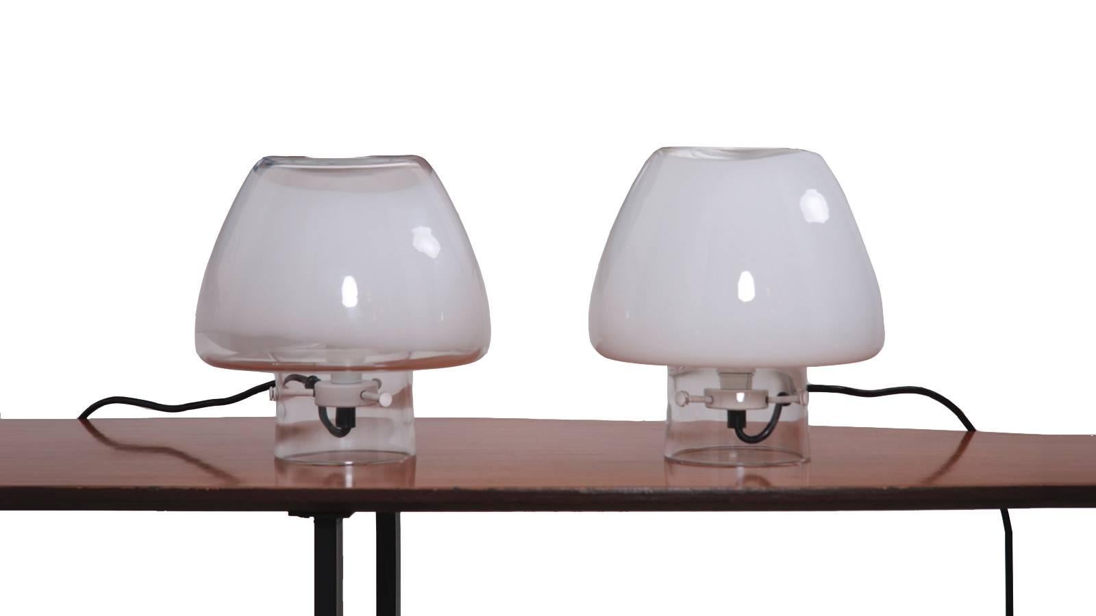 Pair of table lights by Angelo Mangiarotti. This model is no longer in production and highly collectable. Its light is adjustable with dimmer.