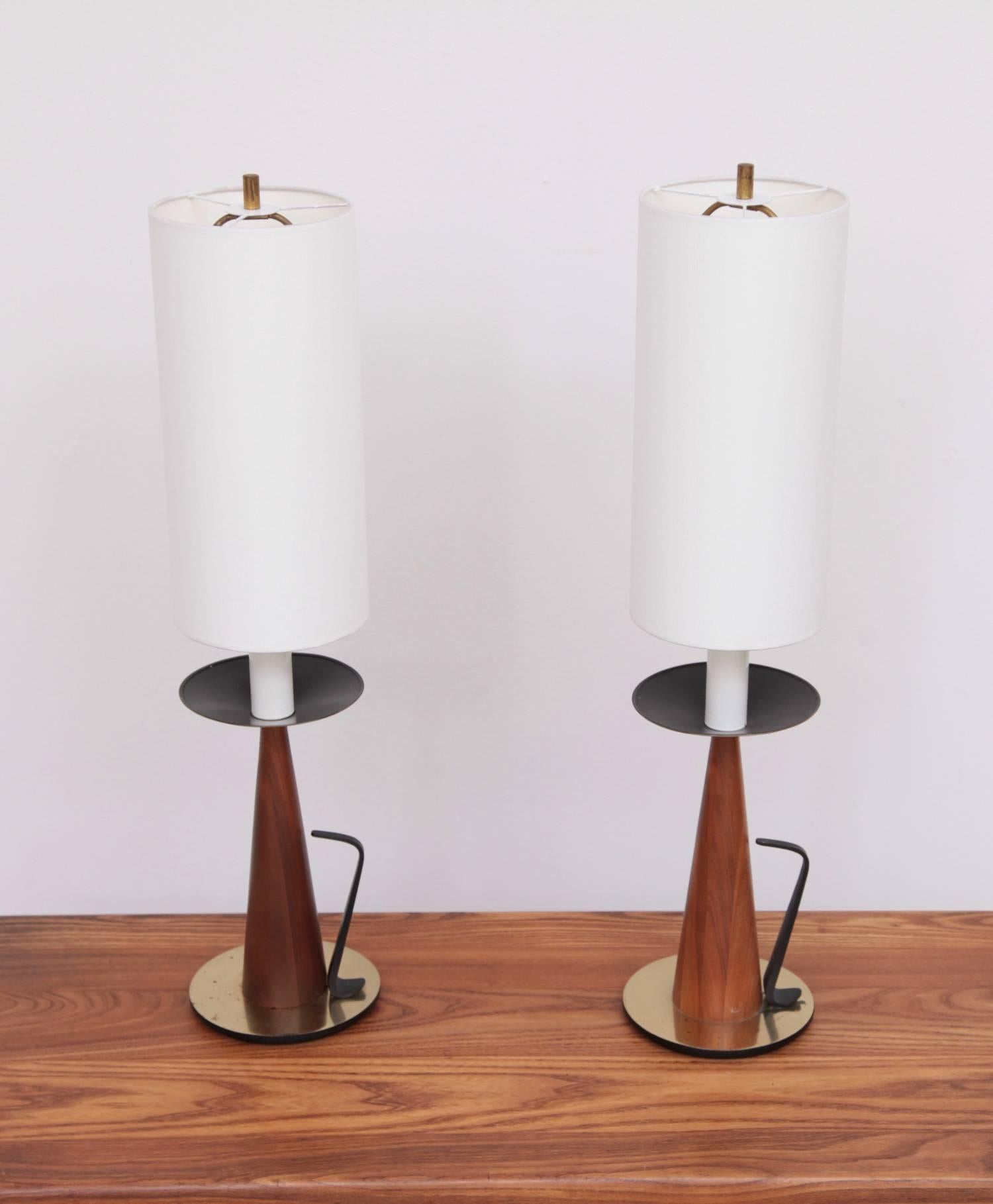Pair of Tony Paul table lamps for Westwood Lighting in walnut and brass with new shades.