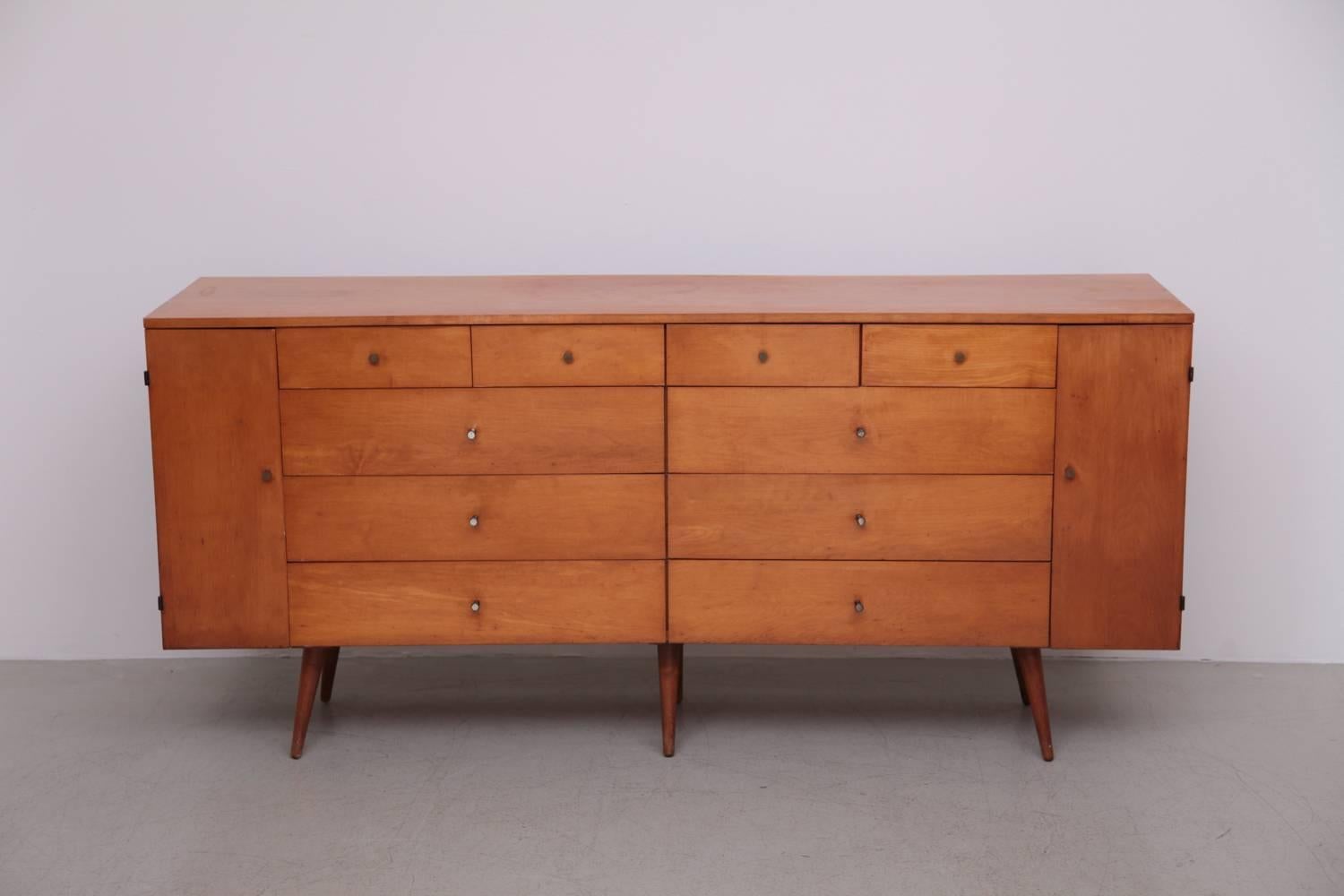 Solid maple McCobb 20-drawer dresser features the Classic cone pulls and maple finish that made this Mid-Century furniture line so popular. Original beautiful patina.