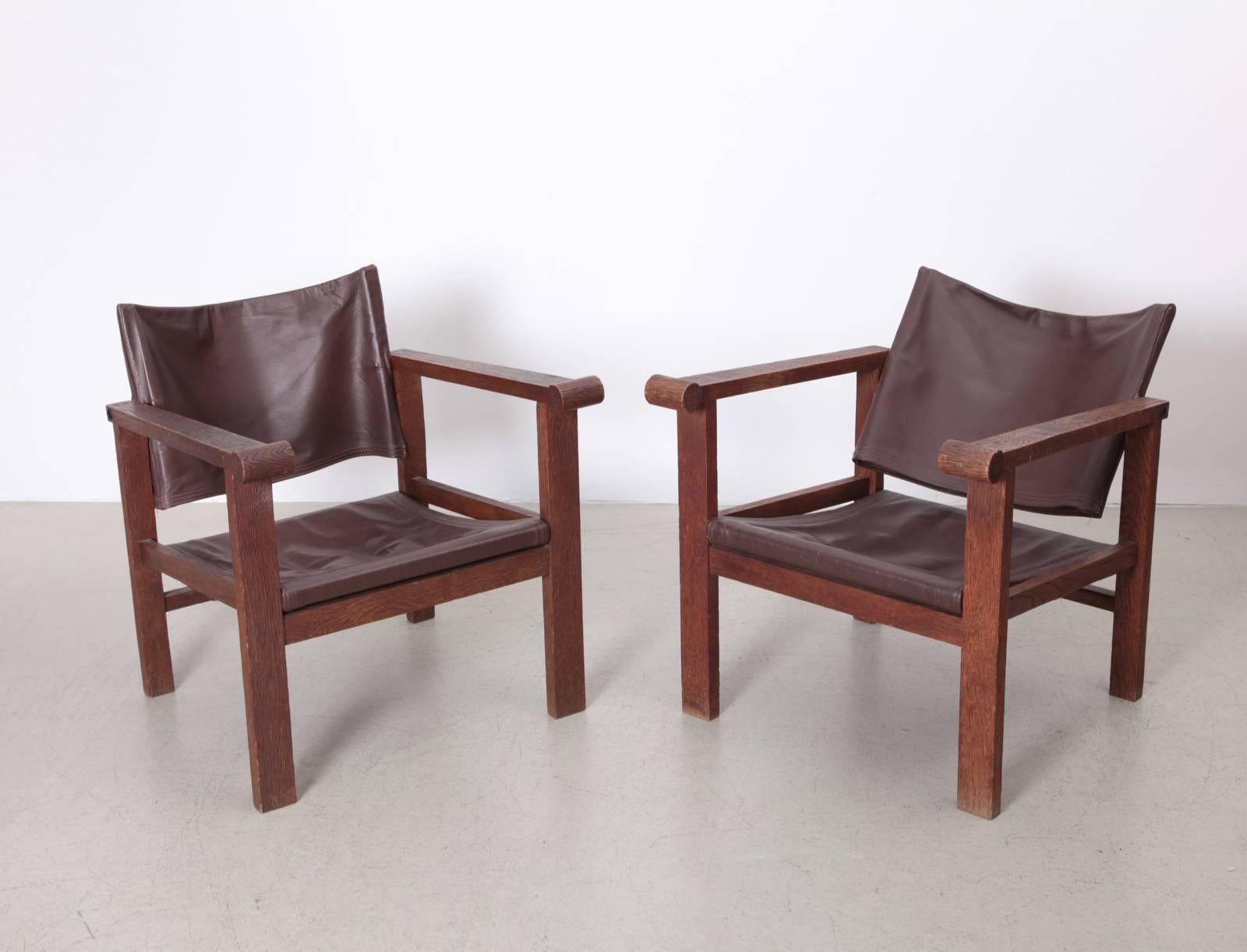 Pair of Art Deco reclining sling back leather lounge chairs. During production, the wooden parts are submitted through a specialized process whereby the wood is dipped into acid in order to soften the fibres of the wood. Softened fibres are then