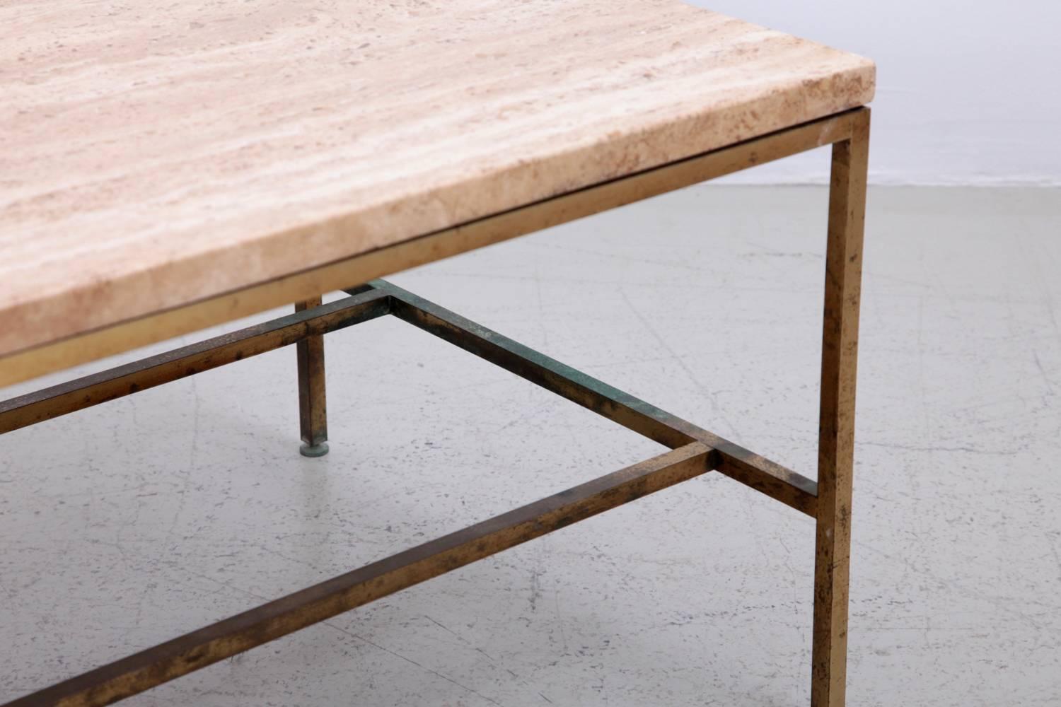 Brass end table with a travertine marble-top by Paul McCobb (1917-1969) for Calvin Furniture Company (1953-1973) with a strong patina on the brass that could be polished for sure but we loved and kept it.

