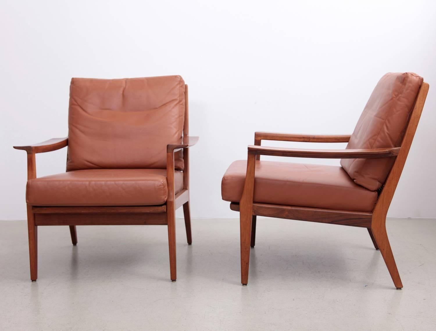 We offer one pair of Danish lounge chairs in wood. High quality production! Please see the details.

