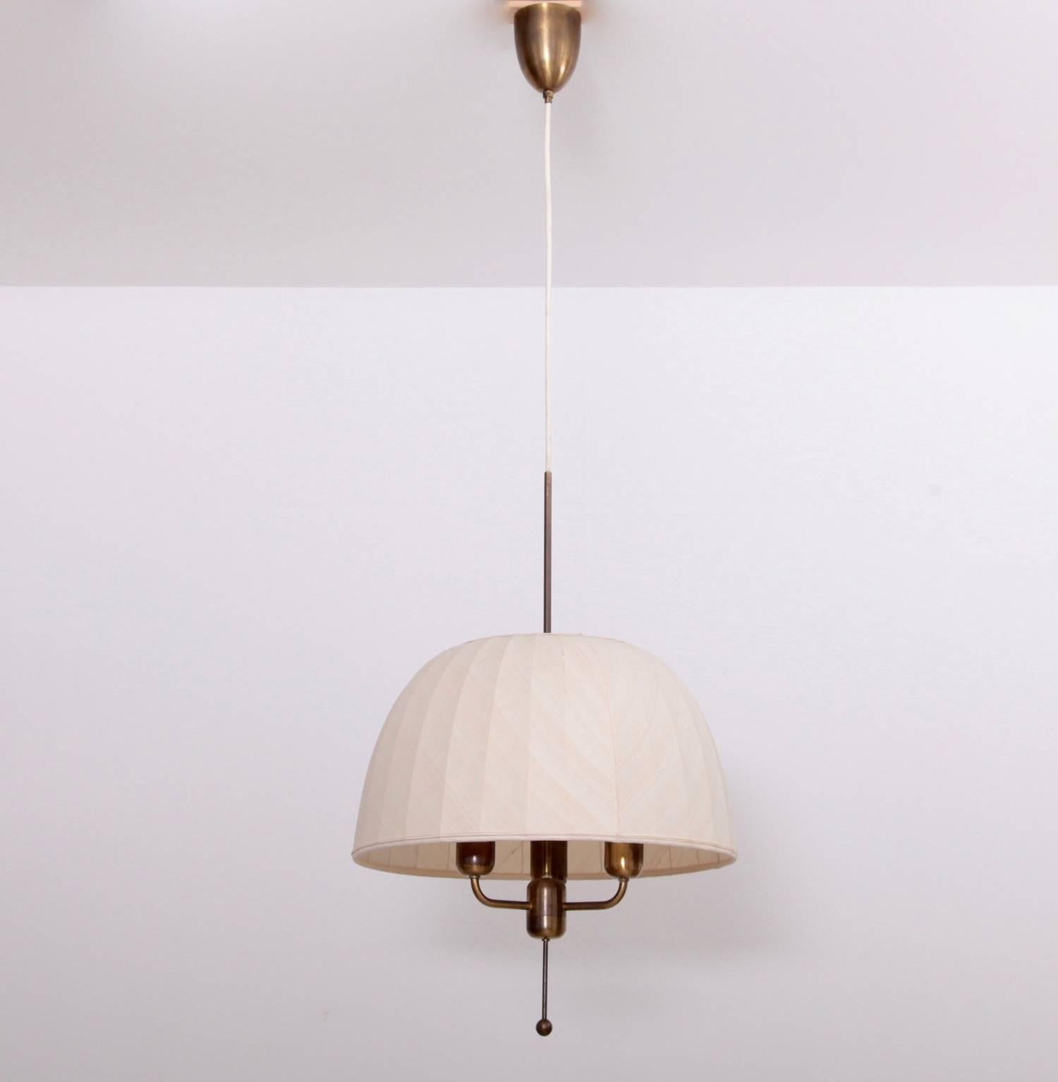 Beautiful and rare large ceiling light with three light sources in brass with a hand-stitched silk shade designed by Hans-Agne Jakobsson for Hans-Agne Jakobsson AB Markaryd Sweden in 1963. 3 x E27/Model A and 75 watts each max.