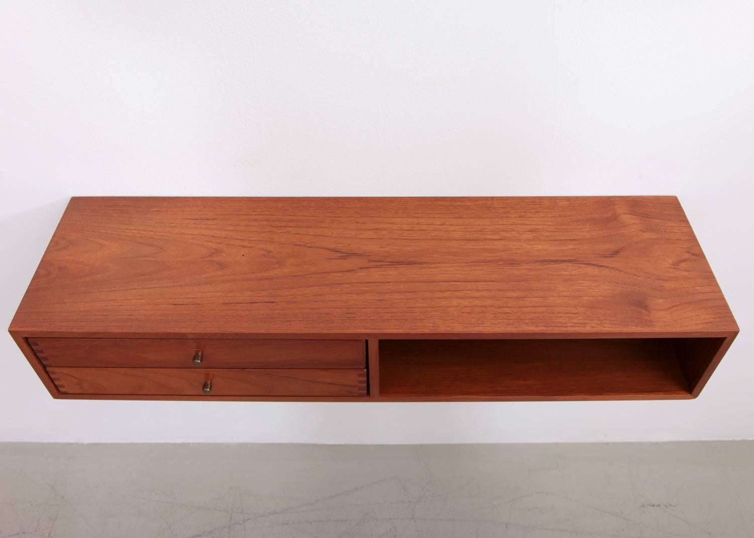 Wall-mounted console made of teakwood, designed by Kai Kristiansen and produced by Aksel Kjersgaard, Denmark.