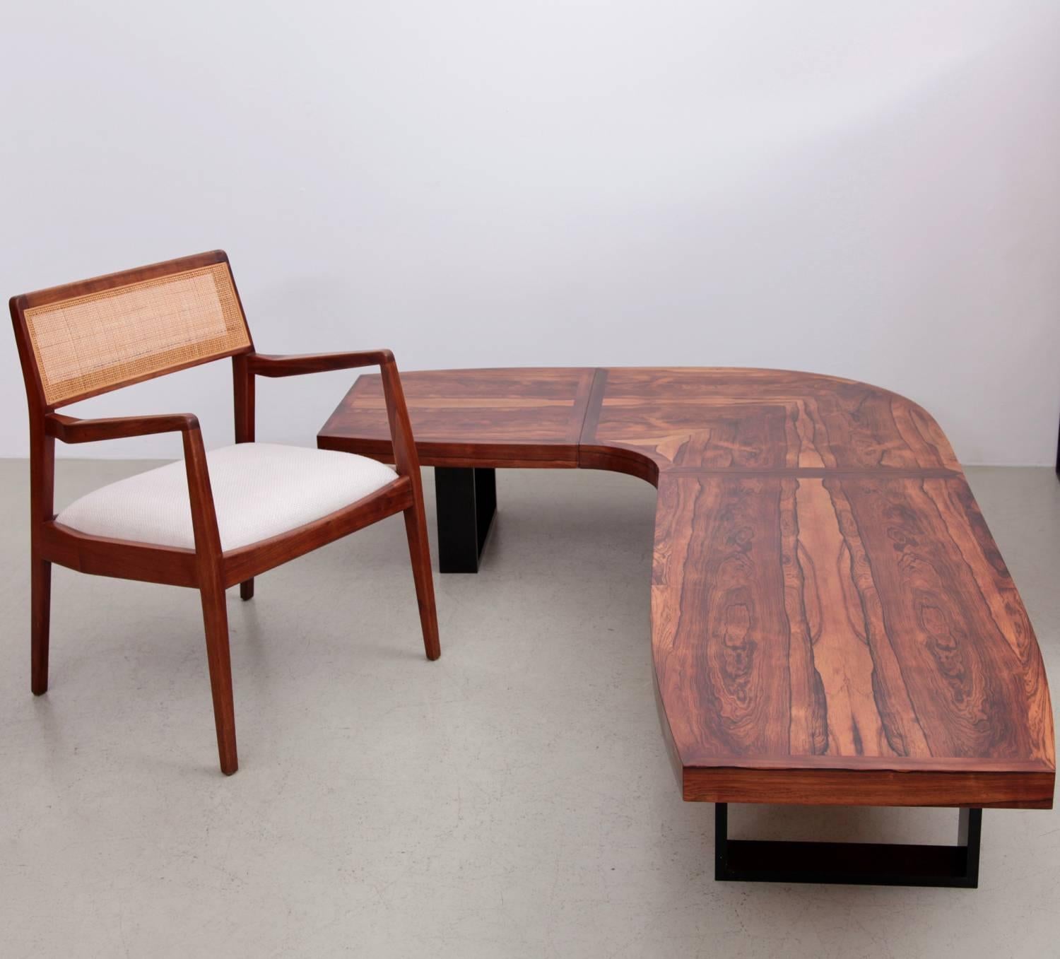 Absolute stunning coffee table with the most beautiful rosewood grain ever.
The black painted solid wood legs are a newer production and were added later.
    
   