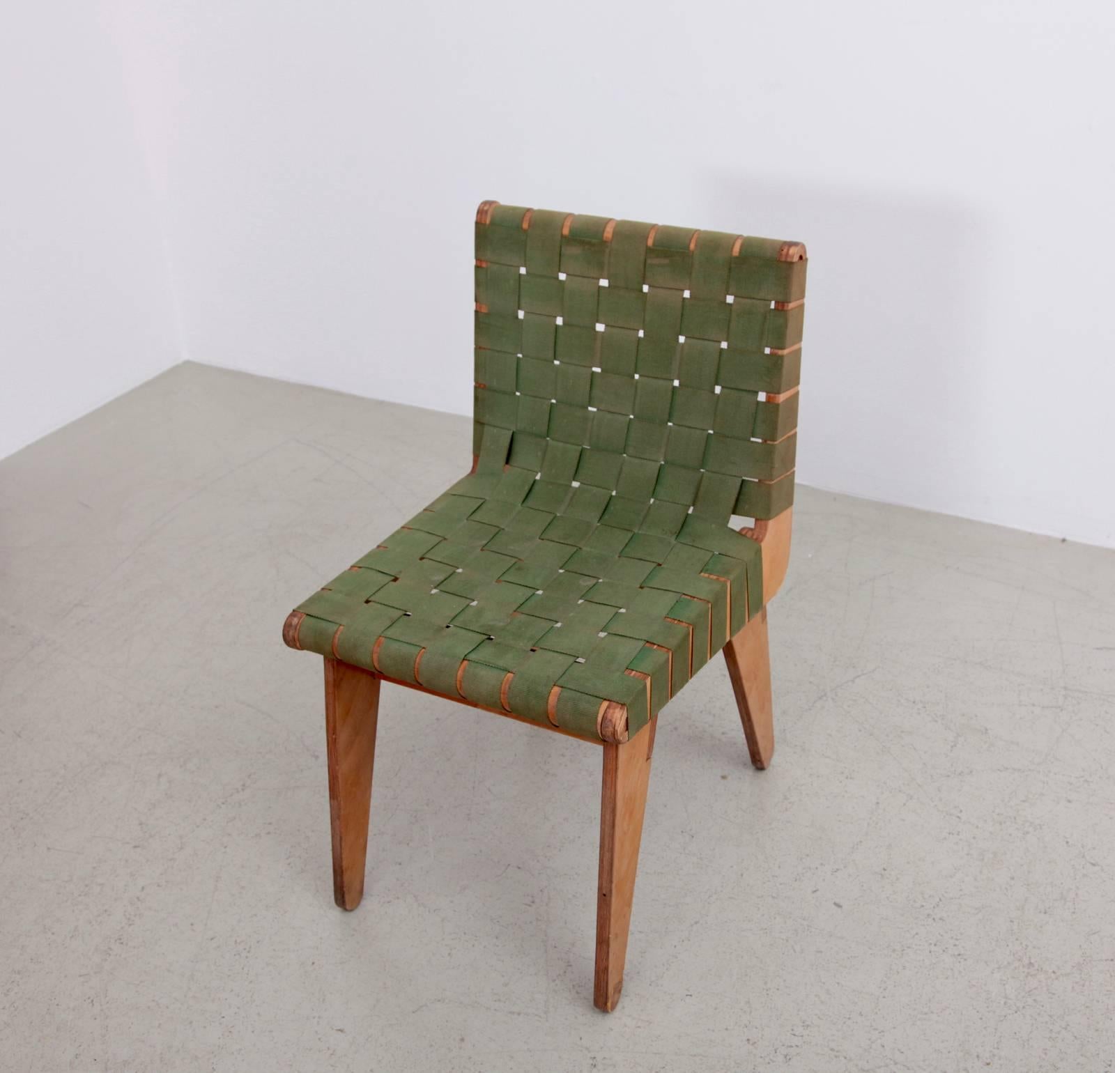 Hand built chair with green army surplus strapping and pitch pine frame, 1949. Klaus Grabe was a German designer and architect who emigrated to the United States with fellow Bauhaus members in 1933. Influenced by Breuer's works in plywood, Grabbe's