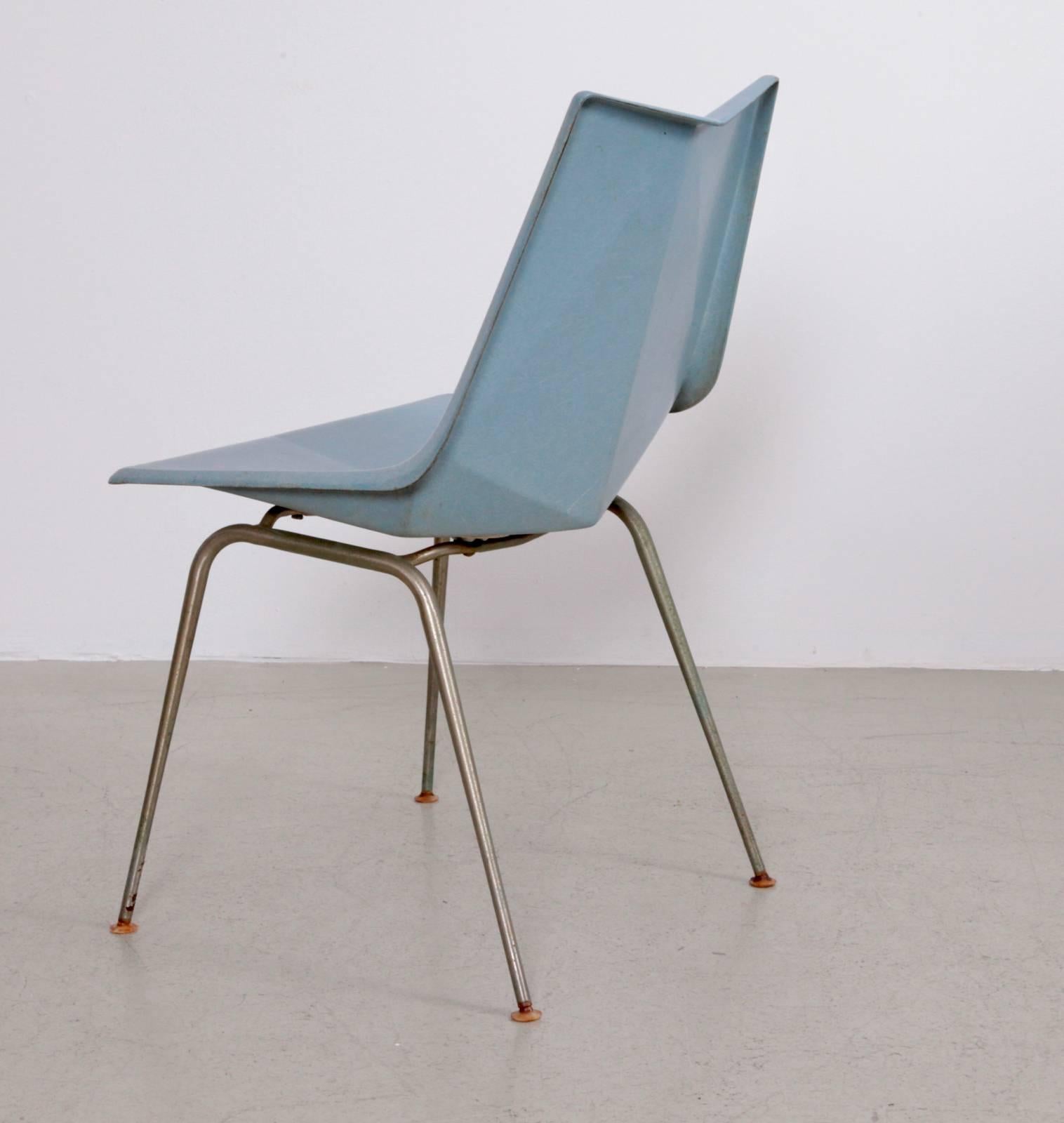 A 1950s light blue Paul McCobb Origami chair for St. John Seating. The fiberglass seat is molded at angles, reminiscent of the Japanese origami technique. The chair stands on tubular iron legs. Labeled and in a good and original condition.