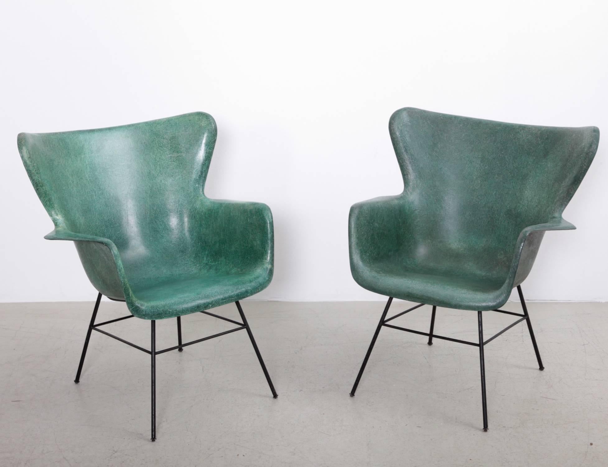 Pair of Luther Conover fiberglass and black wire iron lounge chairs. Strong exposed fibers.