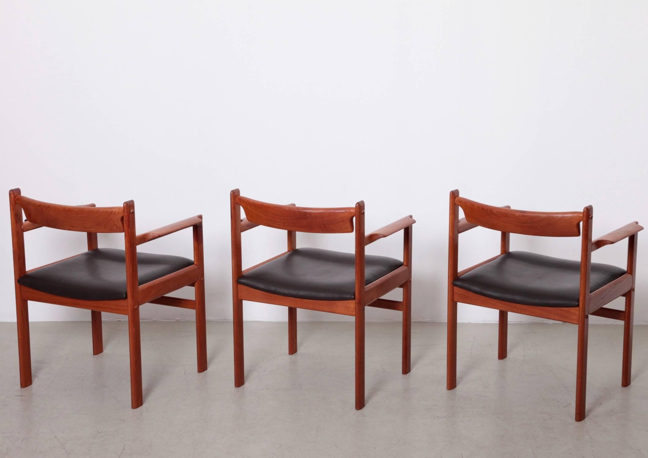 Restored set of three Danish armchairs in solid teak and high quality aniline leather.


