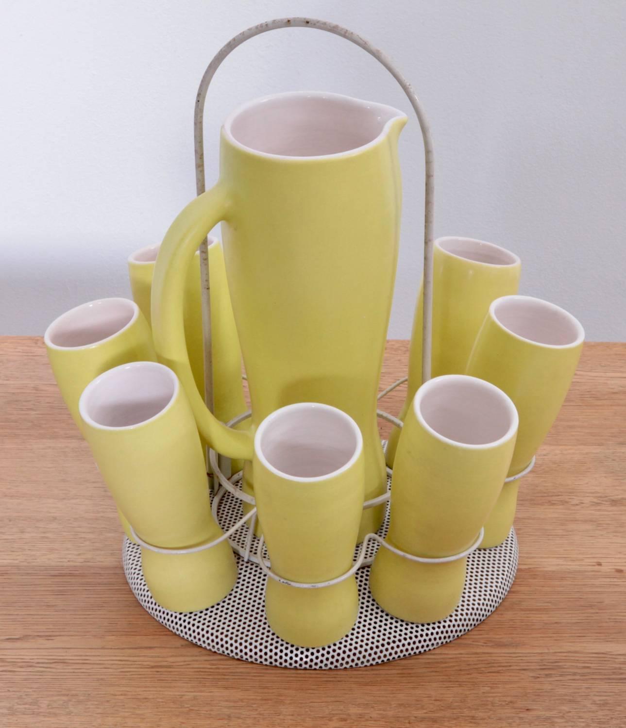 Excellent wine set of a pitcher and eight cups in yellow signed with Pol Chambost. The ceramic is perfect!

