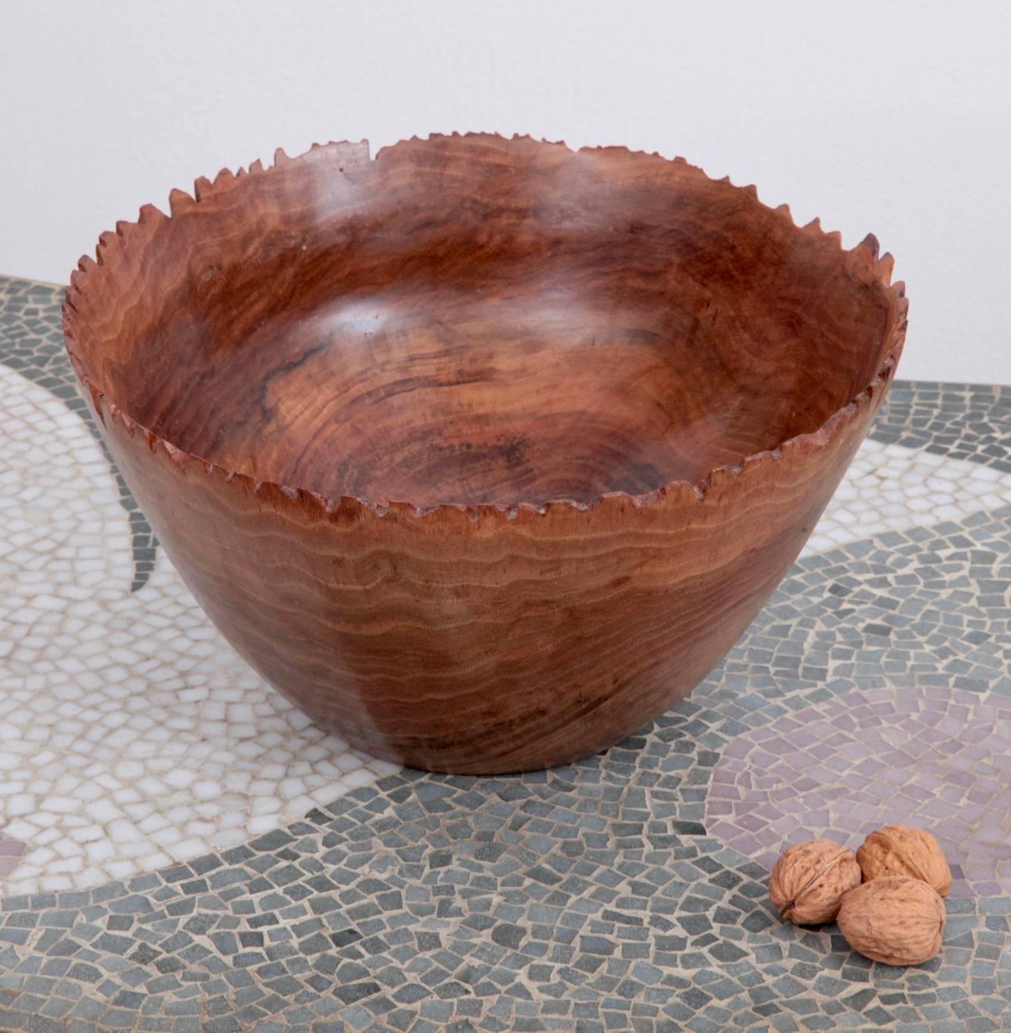 One of a kind large turned wood bowl by German craftsmen Eckart Mohlenbeck in walnut with a very special edge.

