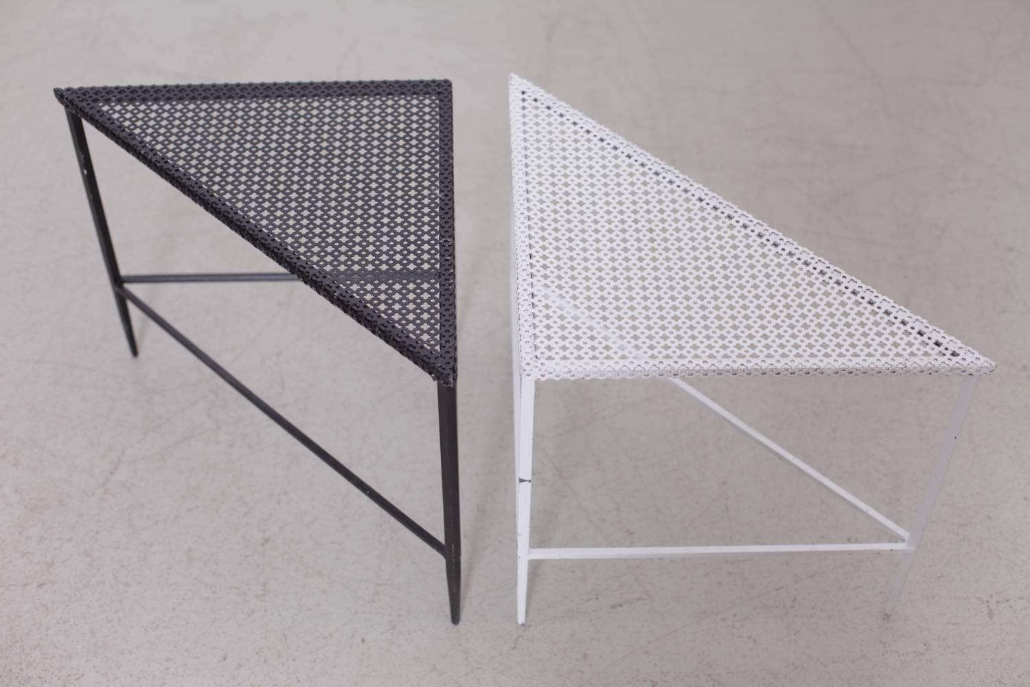 Set of two side or coffee tables designed by Mathieu Matégot.
Manufactured by Ateliers Matégot (France), circa 1950.
Folded, perforated metal lacquered in black and white. 
