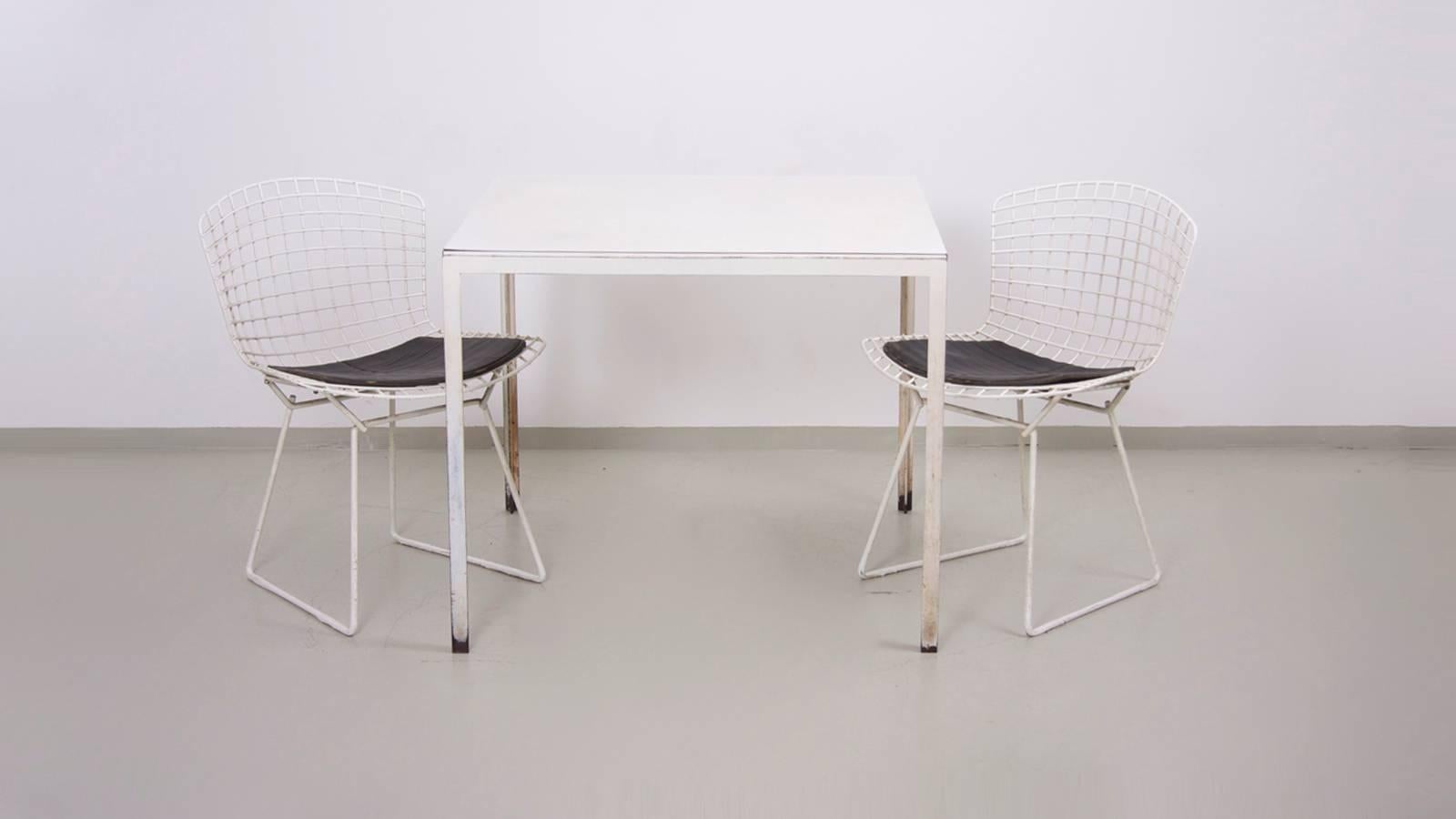 Nice small dining set by Knoll in white, white with vintage chair pads.