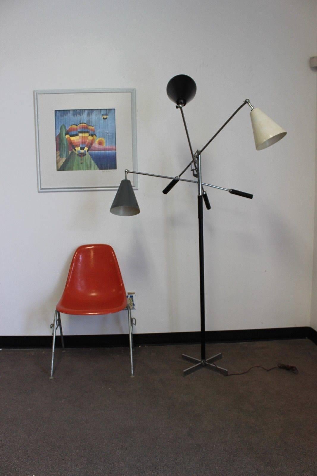 Arredoluce Triennale floor lamp with three original different color shades. Rare base. Stamped 