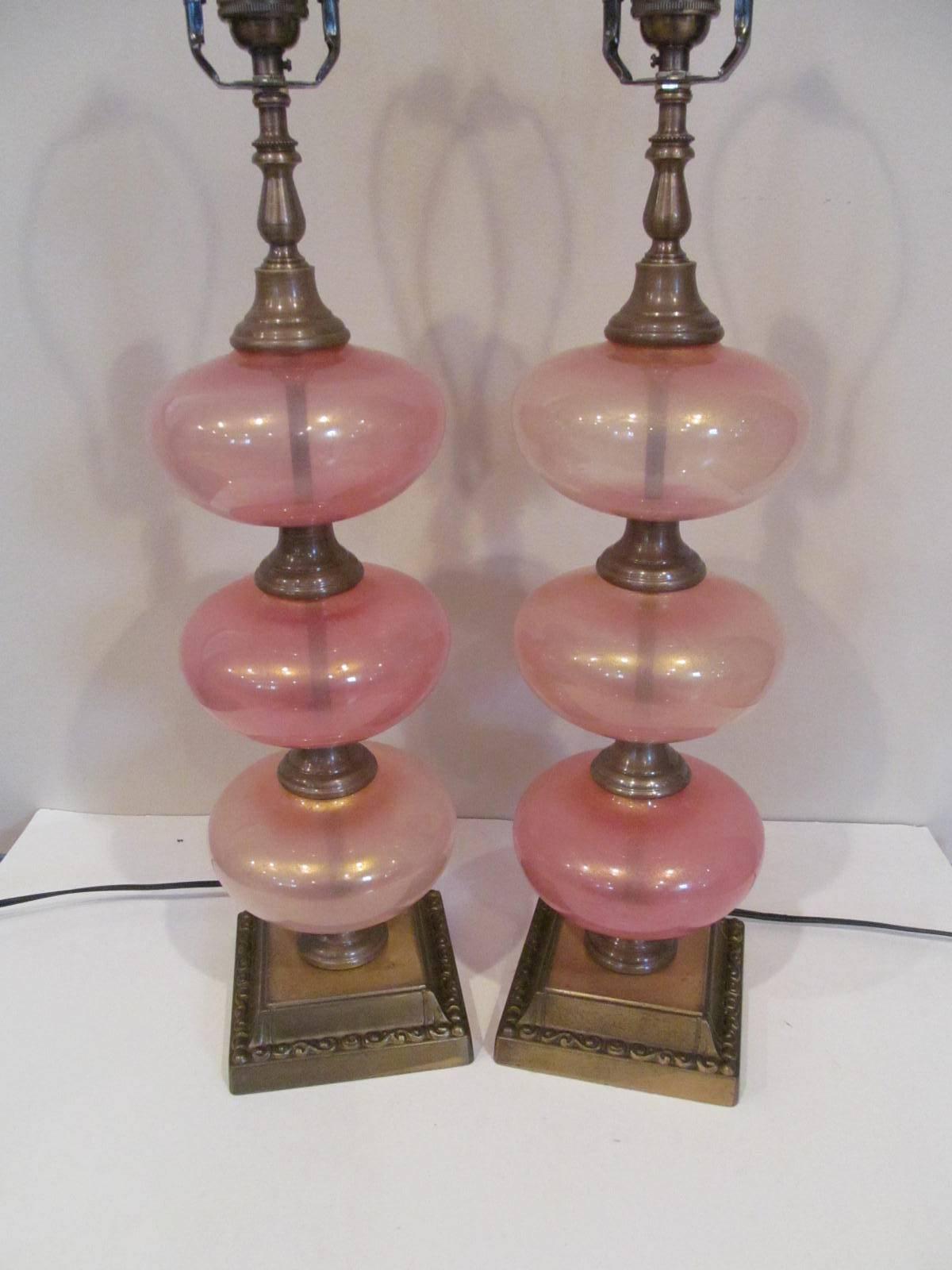 Wonderful pair of Murano lamps in peach color with gold highlights in the glass. The glass was handblown in Murano in the 1950s. This pair of lamps has been rewired and is ready for use. Glass height is 13 1/4 inches.