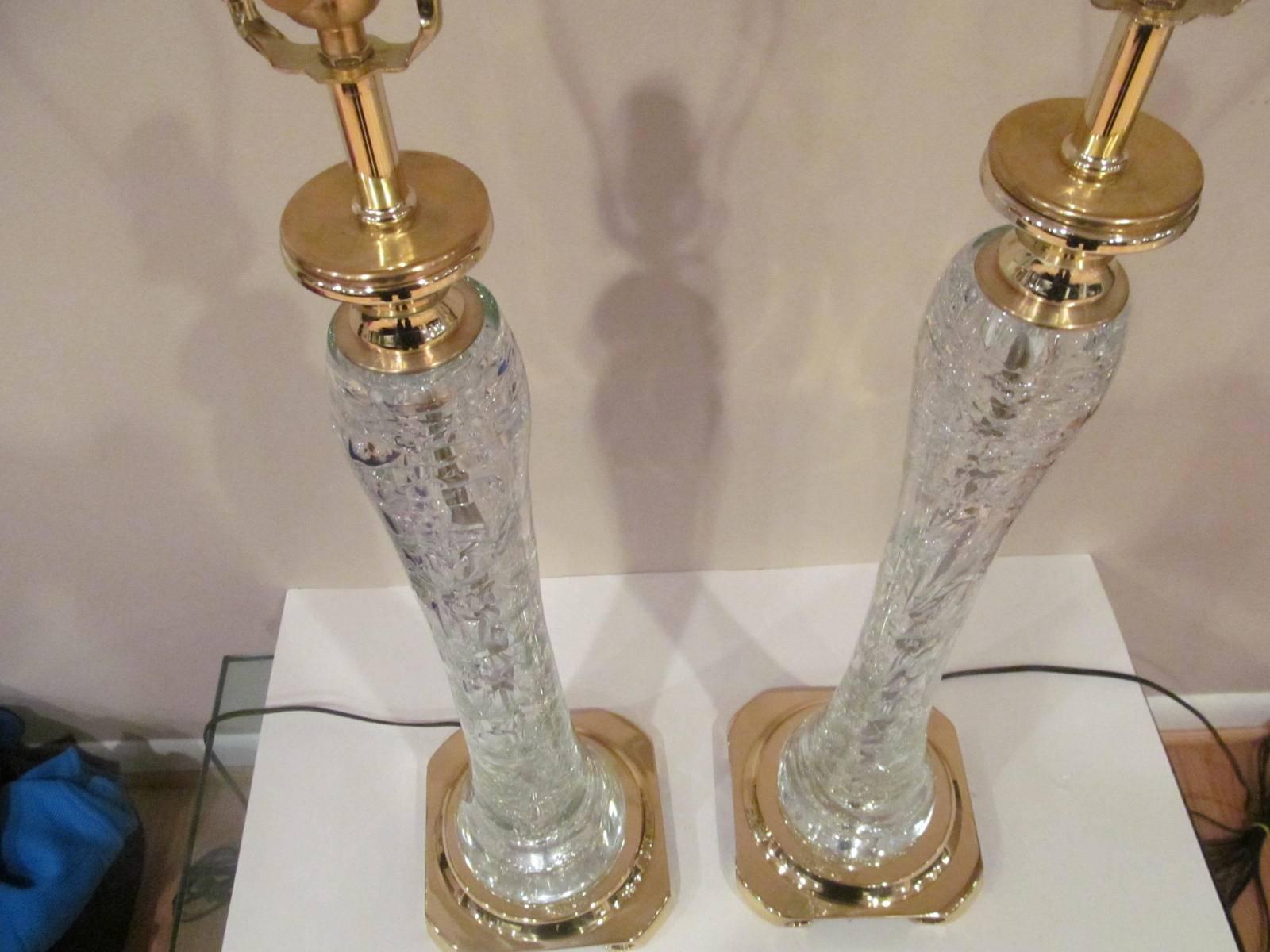Amazing pair of rock crystal table lamps. Each has one very large stand alone piece. Rare and beautiful sculptural table lamps rewired and ready for use.
