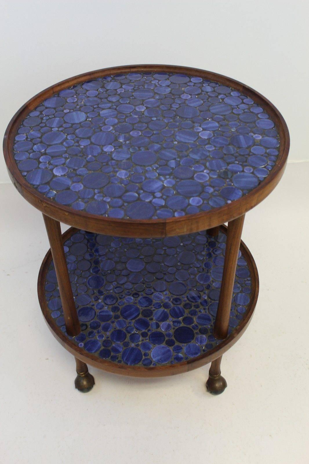 Rare vibrant blue tile, two-tiered rolling table, or bar cart, by Martz. In excellent condition. The dimensions are 24