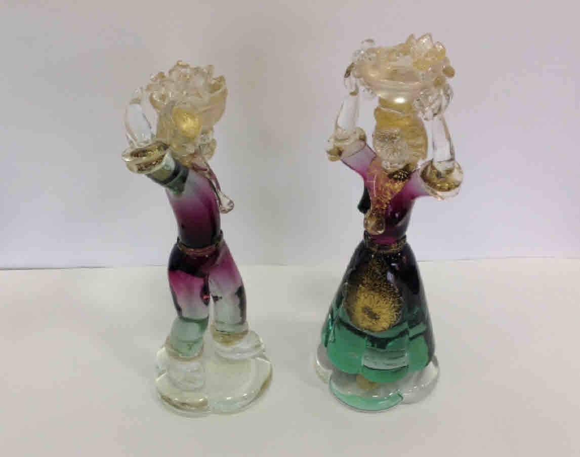Rare pair of Alfredo Barbini for Salviati Murano figures. One retains an original Salviati label. Male is 11.5 by 6 by 4.5 inches. Female is 13.25 by 5 by 5 inches.