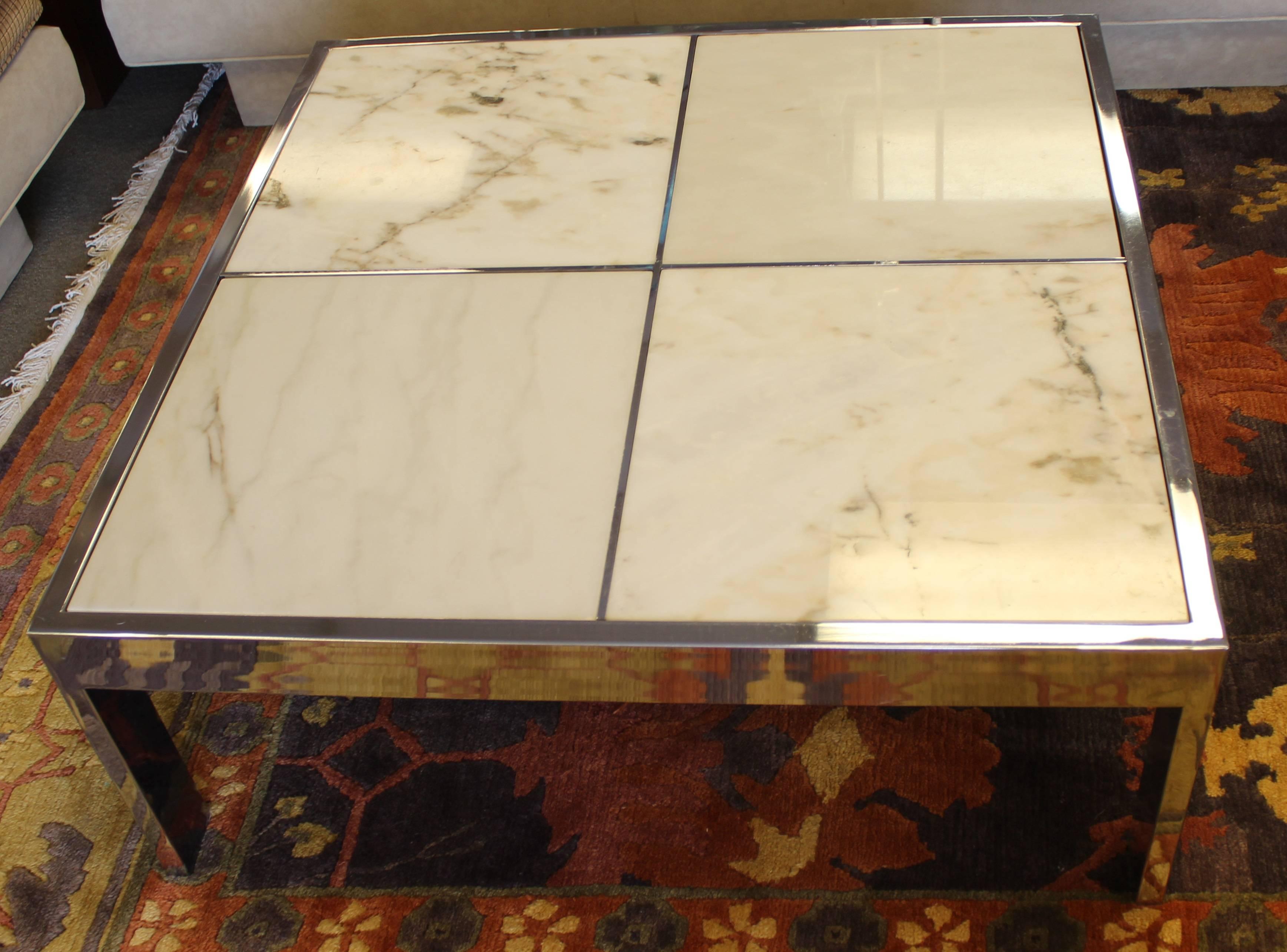 Large and magnificent, square, marble and chrome coffee table by Pace. In excellent condition. The dimensions are 38