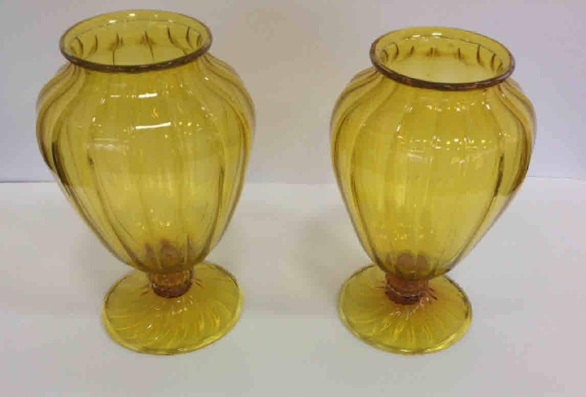 Rare pair of brilliant yellow Murano vases designed by Vittorio Zecchin, circa 1930s. Smaller vase is 10 inches tall, by 5 3/4 inches wide.