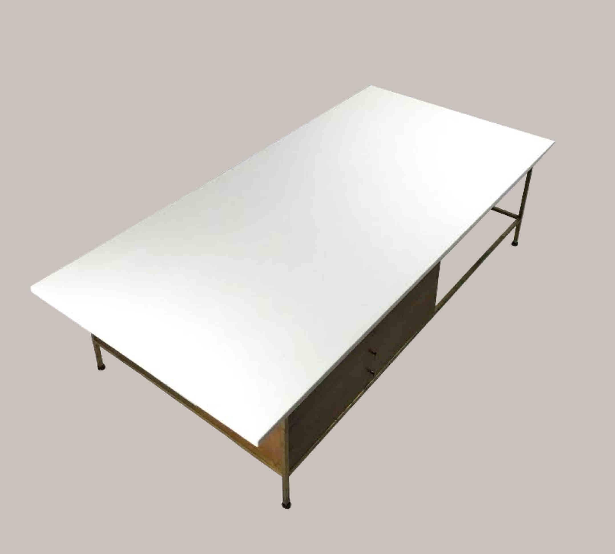 Brass framed coffee table with the original Vitrolite top and three drawers, by Paul McCobb for Calvin furniture. In excellent condition, despite a single chip in the Vitrolite. The dimensions are 66