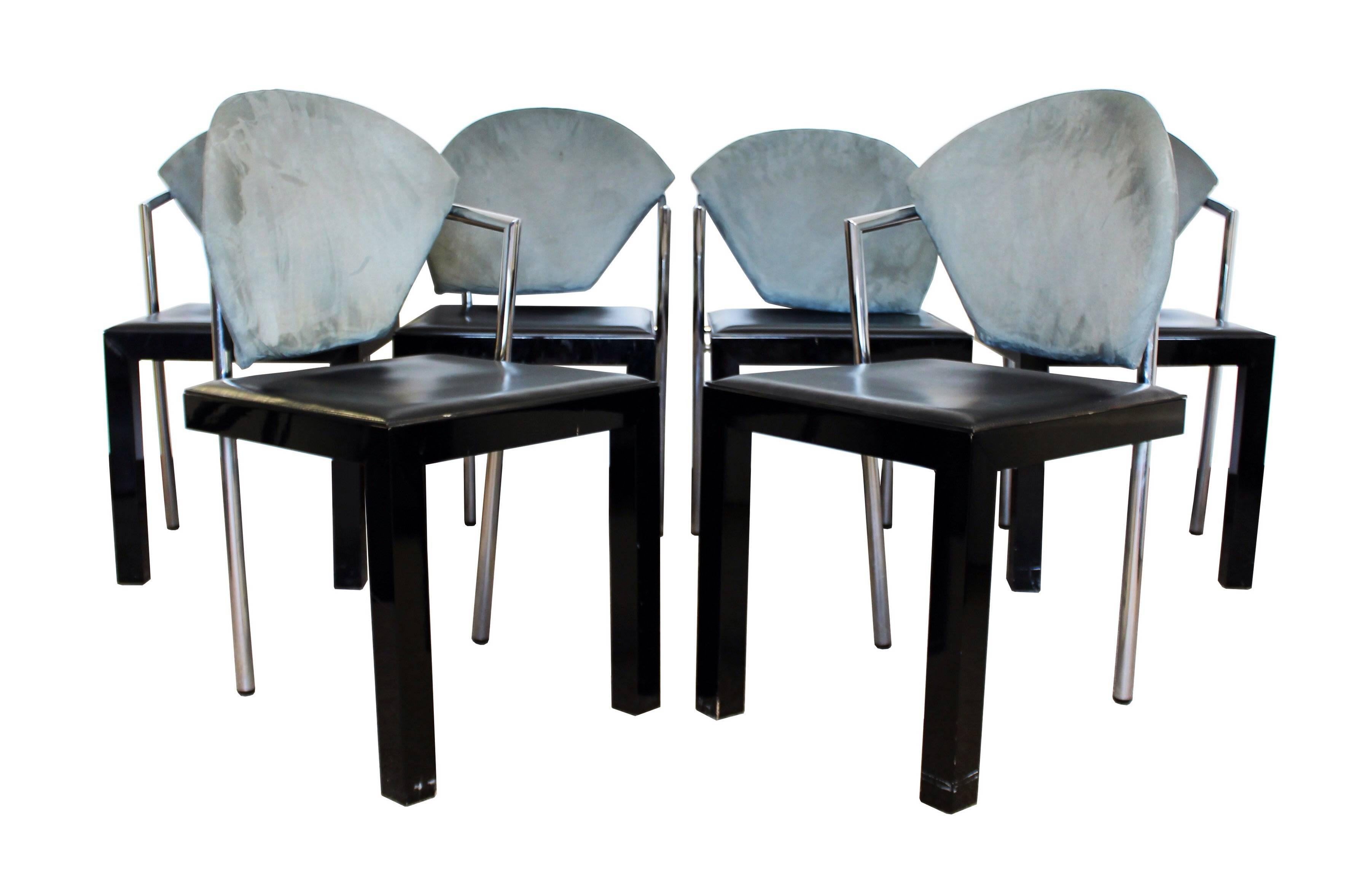 A unique and rare dining table and chairs designed by Giovanni Offredi for Saporiti Italia. The table is a beautiful high gloss lacquer oval wood top, with two architectural concrete inverted bases. Set of six Memphis style contemporary, chrome,
