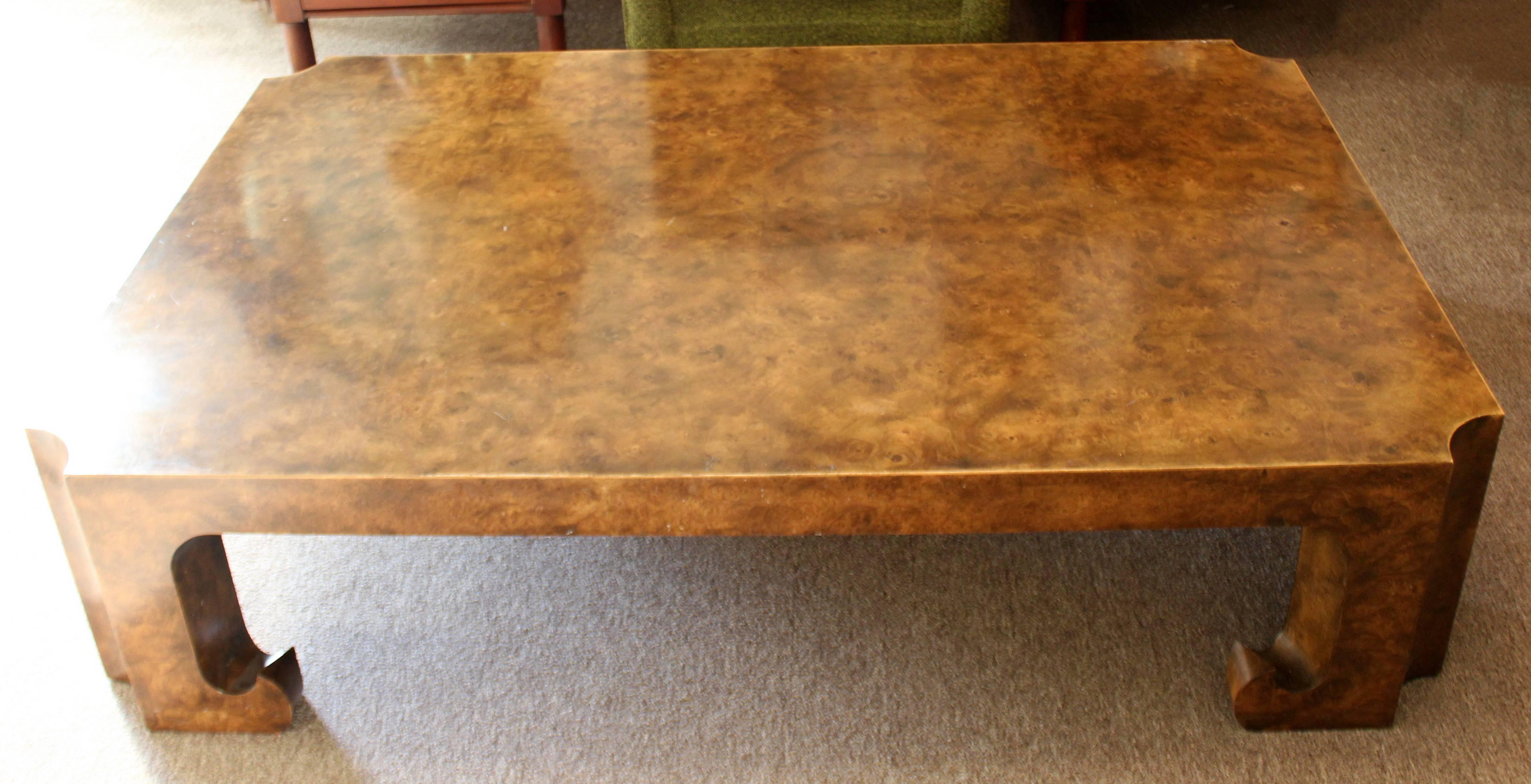 Asian style, burl wood coffee table from the Collector's Edition by Baker. In very good condition. The dimensions are 60