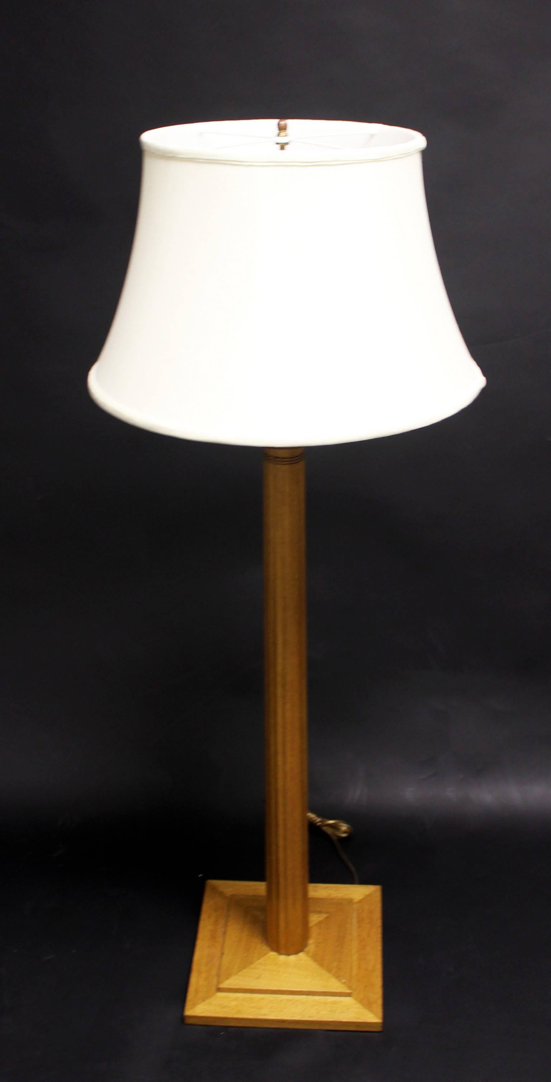 For your consideration is a pair of beautifully crafted floor lamps by T.H. Robsjohn-Gibbings, with their original linen shades. Made of walnut wood and enameled metal in excellent condition. The dimensions of the lamps are 12