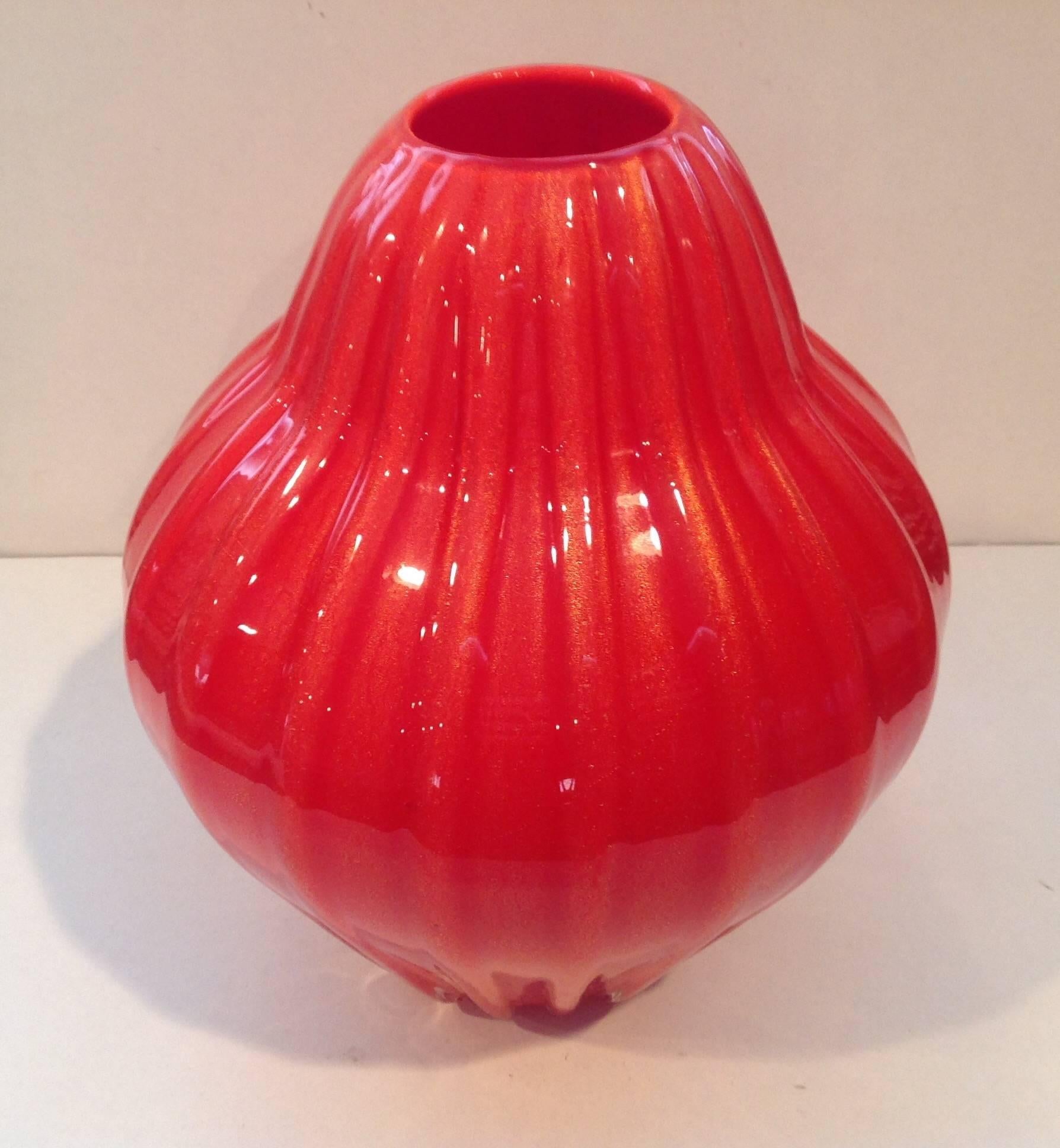 Vibrant orange vase with gold dust. Retains two original labels.