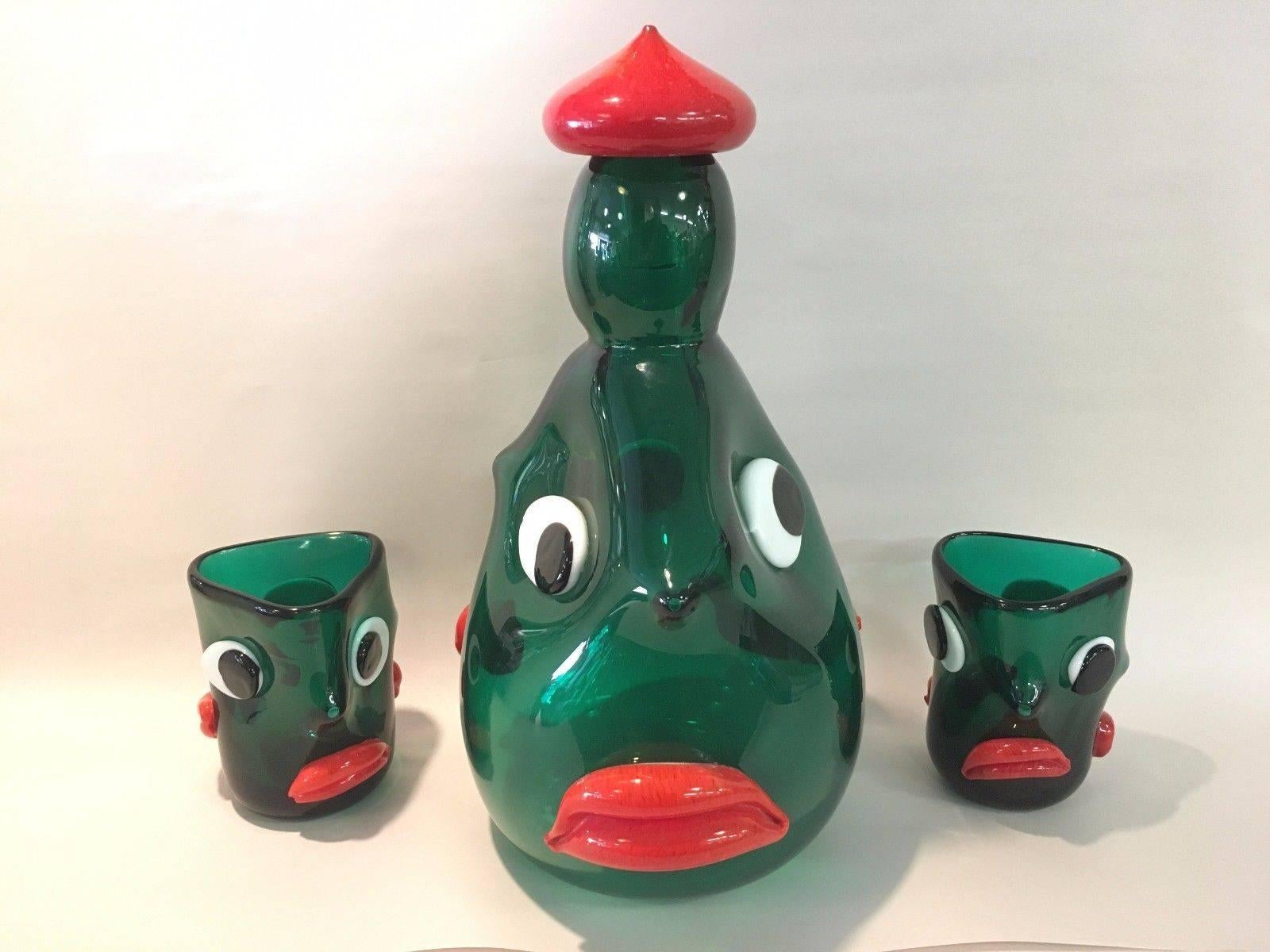 Extremely rare drink set designed by Anzolo Fuga for AVEM. The glasses are documented in many books, I have never seen the matching decanter. Each piece has three faces. Measure: Decanter is 12 1/4 inches tall by 8 inches wide by 7 inches deep. The