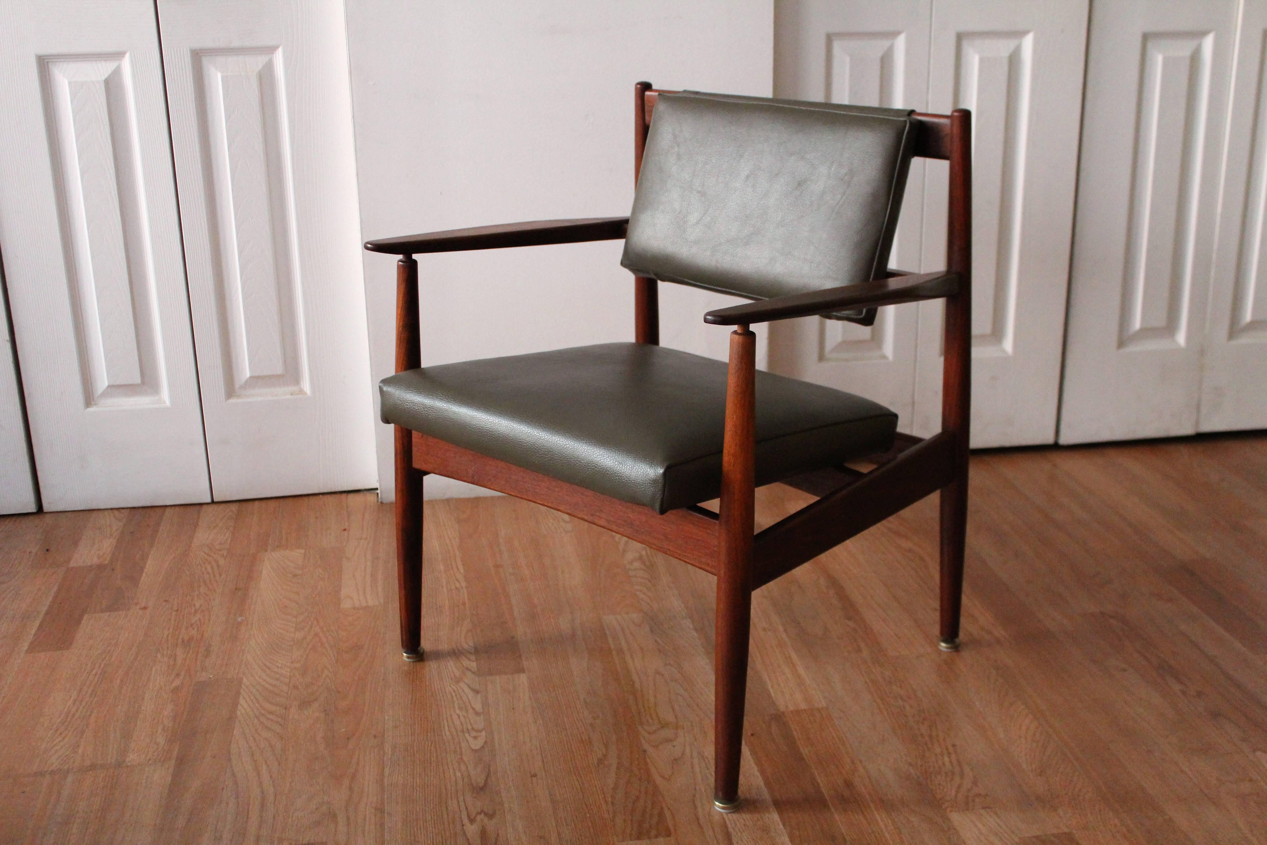 Jens Risom walnut armchair design #C160, newly upholstered in army green spinneybeck leather. Rare.