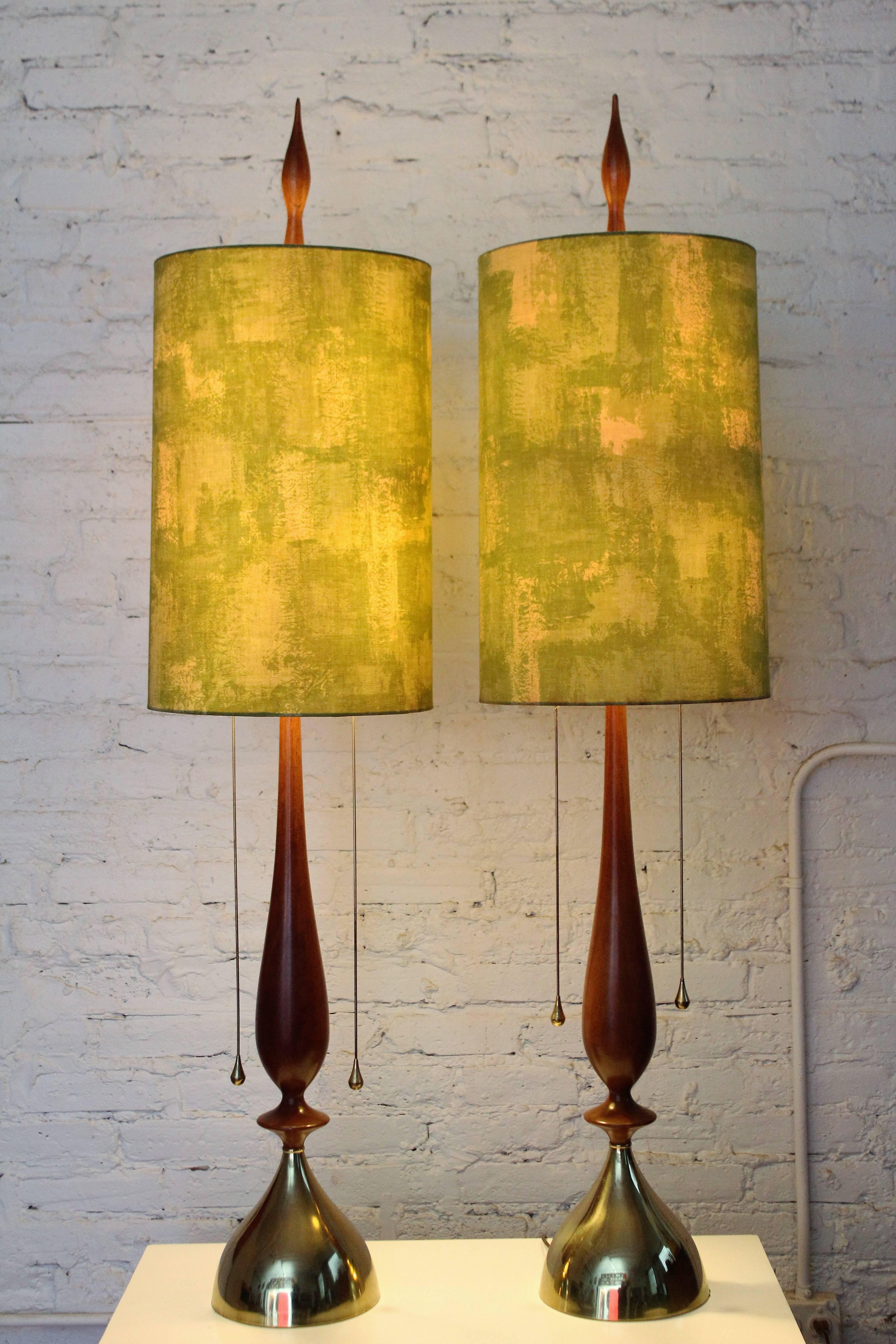 Pair of Frederick Cooper Mid-Century Modern lamps, circa 1960. Statement making table lamps by the master himself. This pair of Frederick Cooper lamps boasts the original shades, finials and pulls. This price is for the pair. Dimensions: 50