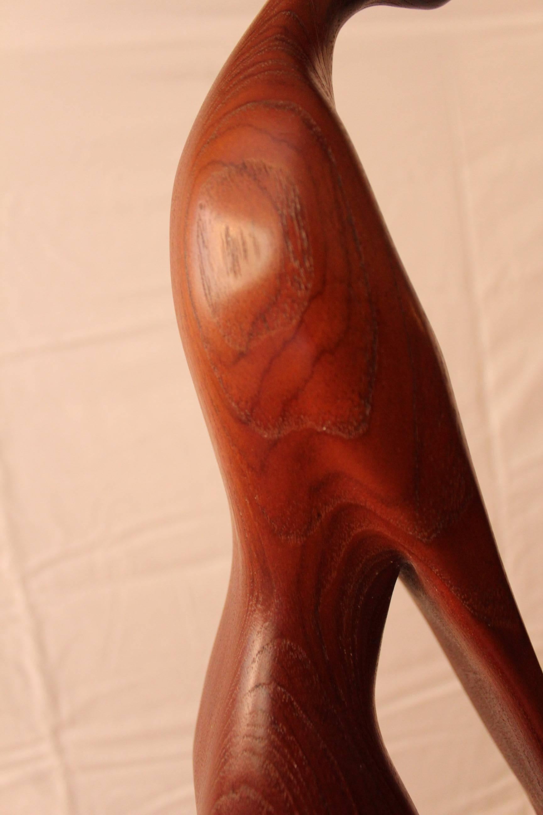 Mother and child solid teak sculpture on a rectangular marble base by artist Gert Olsen. Signed.