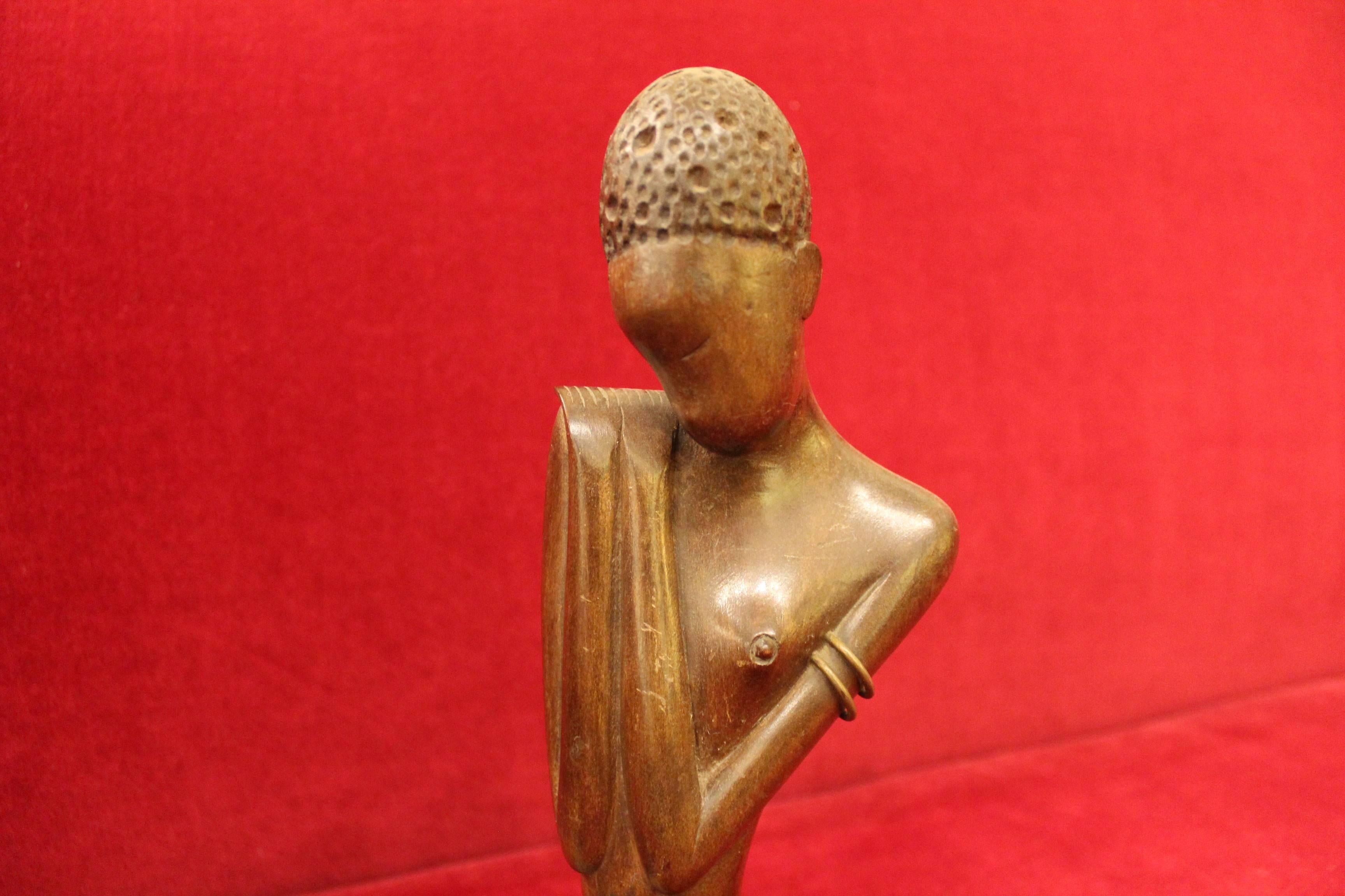 Look at her! Werkstatte Hagenauer Wein (wHw) African Woman, signed and lovingly craved with precious woods! This design is said to be one of the rarest African figurines by the Hagenauer brothers, and if you follow An orange moon, you know we are