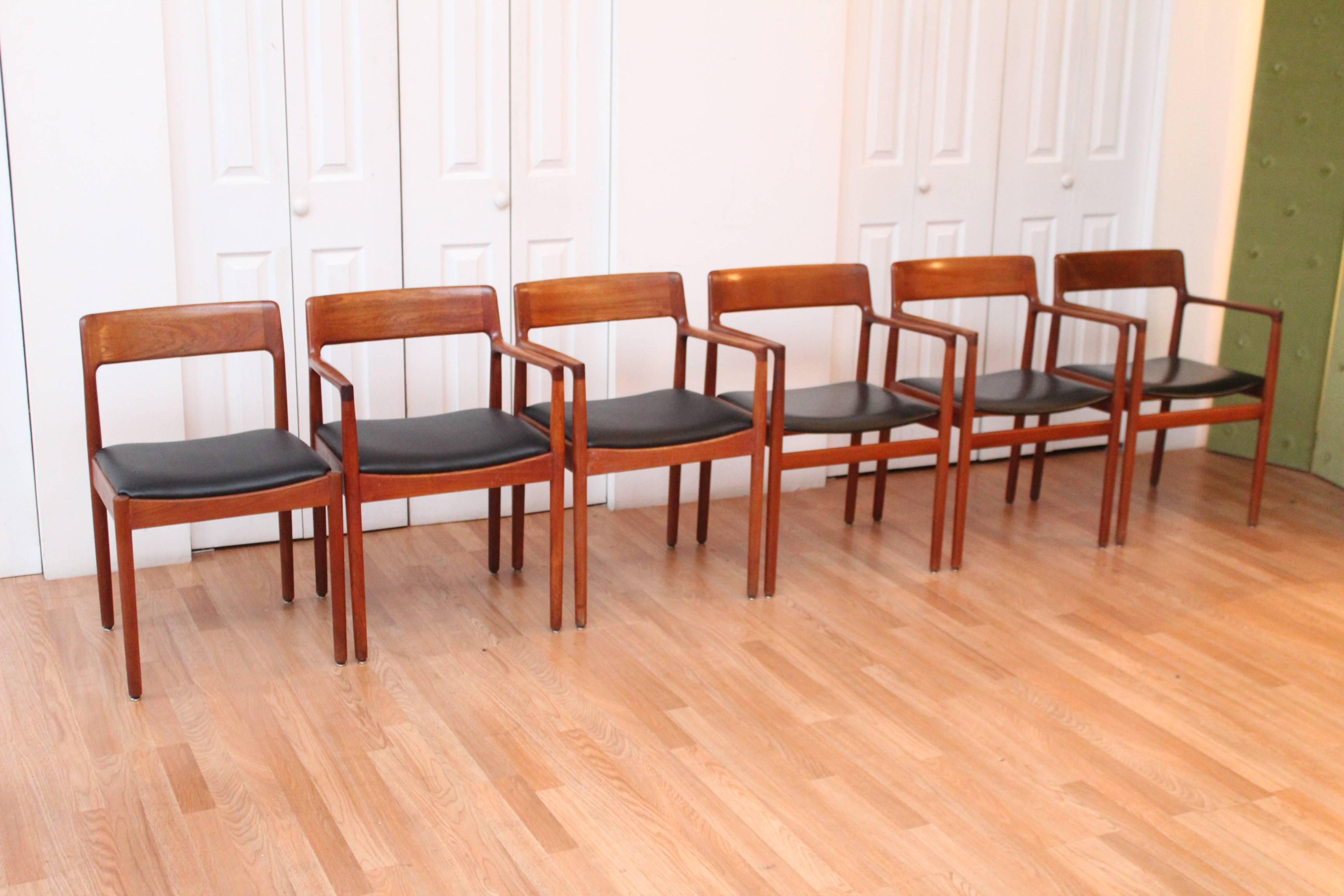 Five-arm and one side exquisitely constructed chairs by Johannes Norgaard for Norgaard Mobelfabrik, Denmark. These solid, strong, sturdy, stylish chairs are well built of a cabinet makers quality and rarely are seen on the open market. An orange