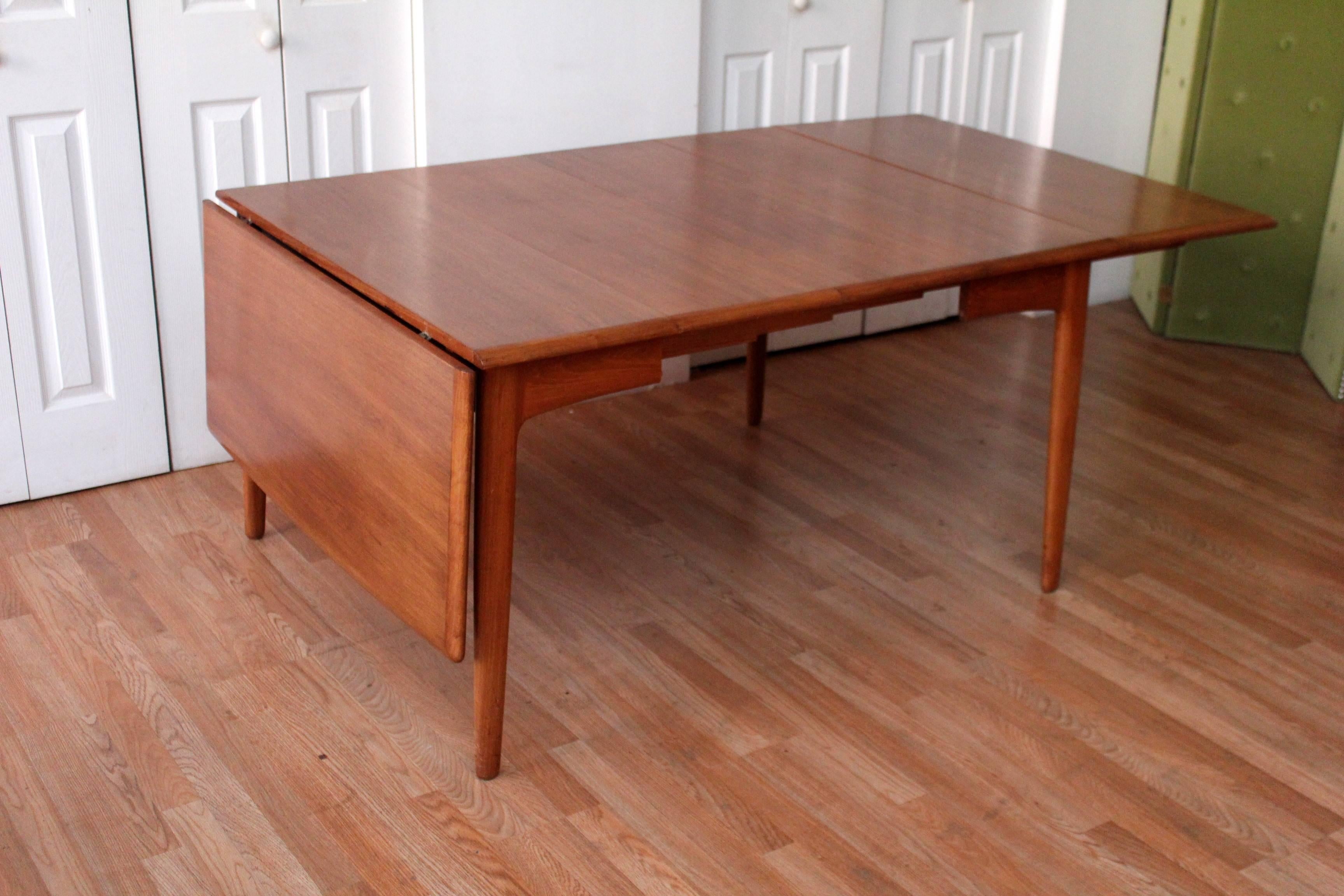 Pettiest teak patina to date! 

Danish drop-leaf table by Svend Madsen, comes resplendent with two leaves. Danish dining table with two leaves,
Perfect space saver for a small space yet perfect for entertaining due to the flexibility of this