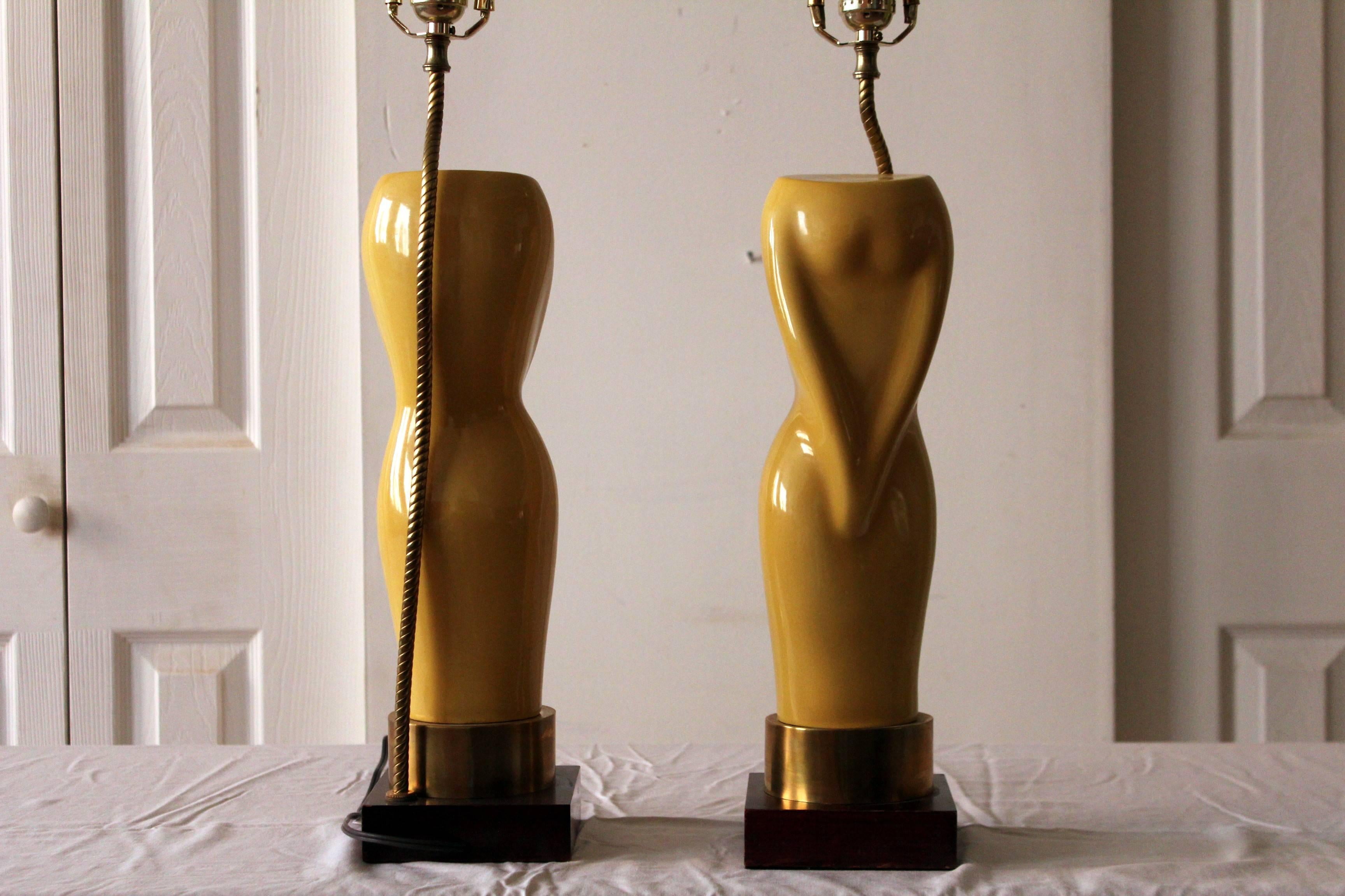 Hollywood Regency Pair of Womens Figural Yellow Lamps with White Shades For Sale